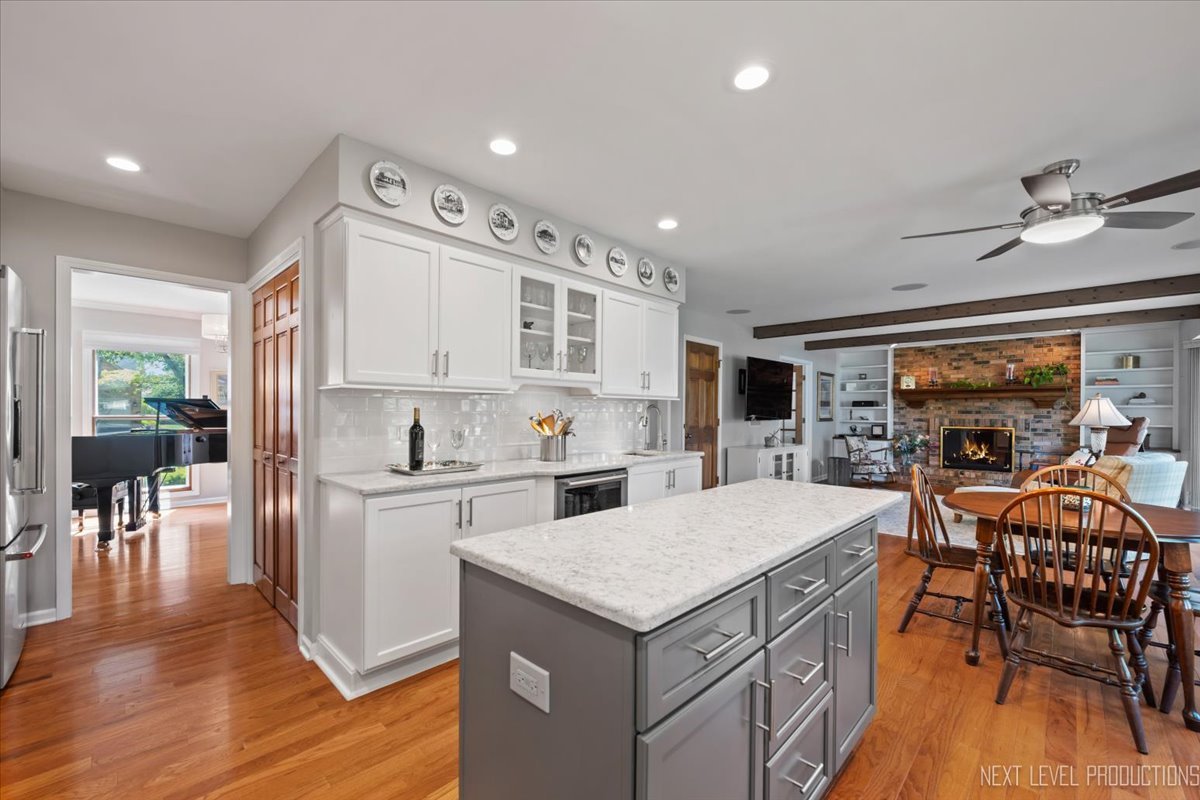 912 Turnbridge Circle Naperville, IL 60540 - Photo 15 of 34 a kitchen with a table chairs refrigerator and cabinets