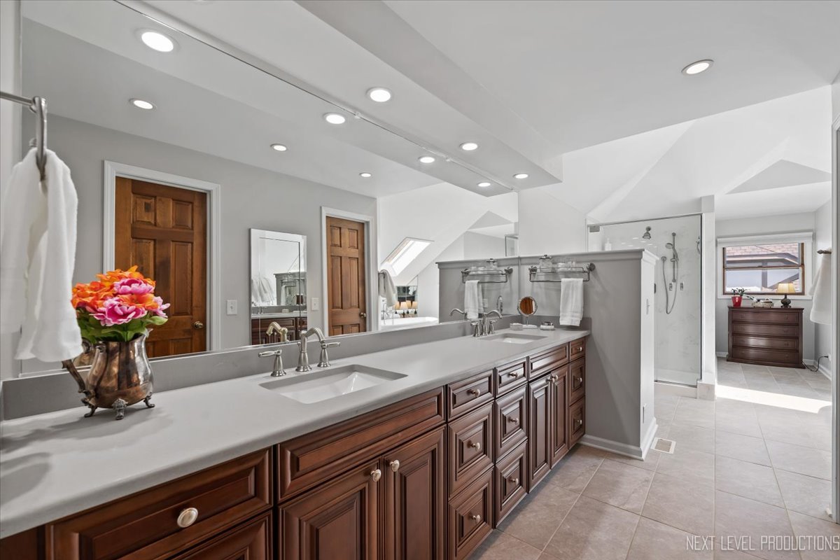 912 Turnbridge Circle Naperville, IL 60540 - Photo 23 of 34 a spacious kitchen with stainless steel appliances a sink and a refrigerator