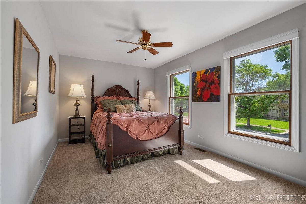 912 Turnbridge Circle Naperville, IL 60540 - Photo 26 of 34 a bed room with a bed and a window