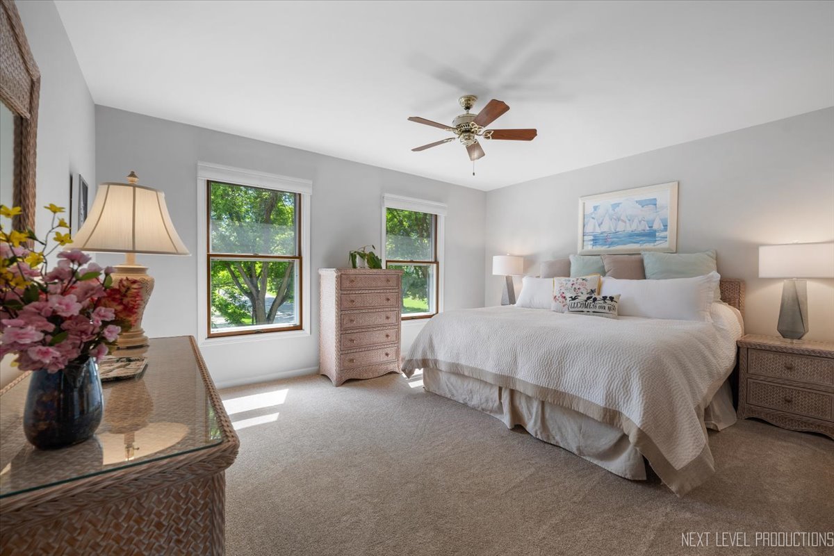 912 Turnbridge Circle Naperville, IL 60540 - Photo 28 of 34 a spacious bedroom with a bed and a window