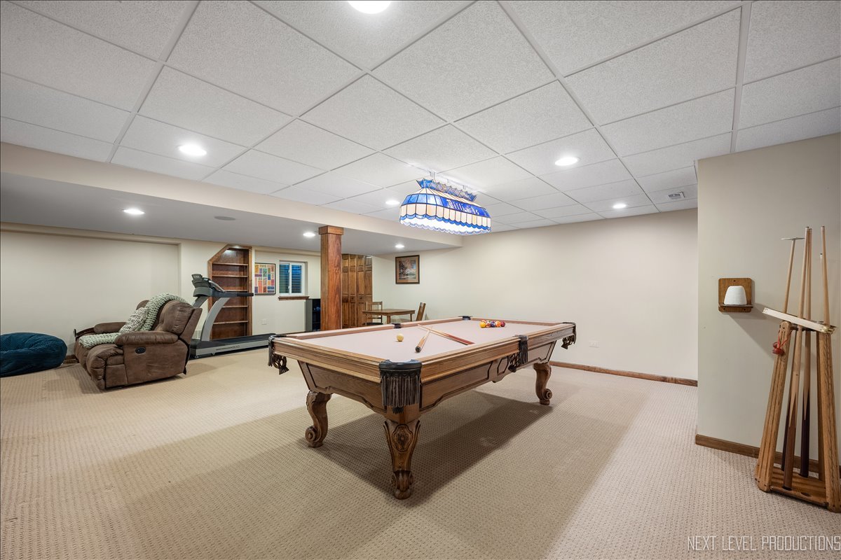 912 Turnbridge Circle Naperville, IL 60540 - Photo 30 of 34 a room with furniture and a flat screen tv