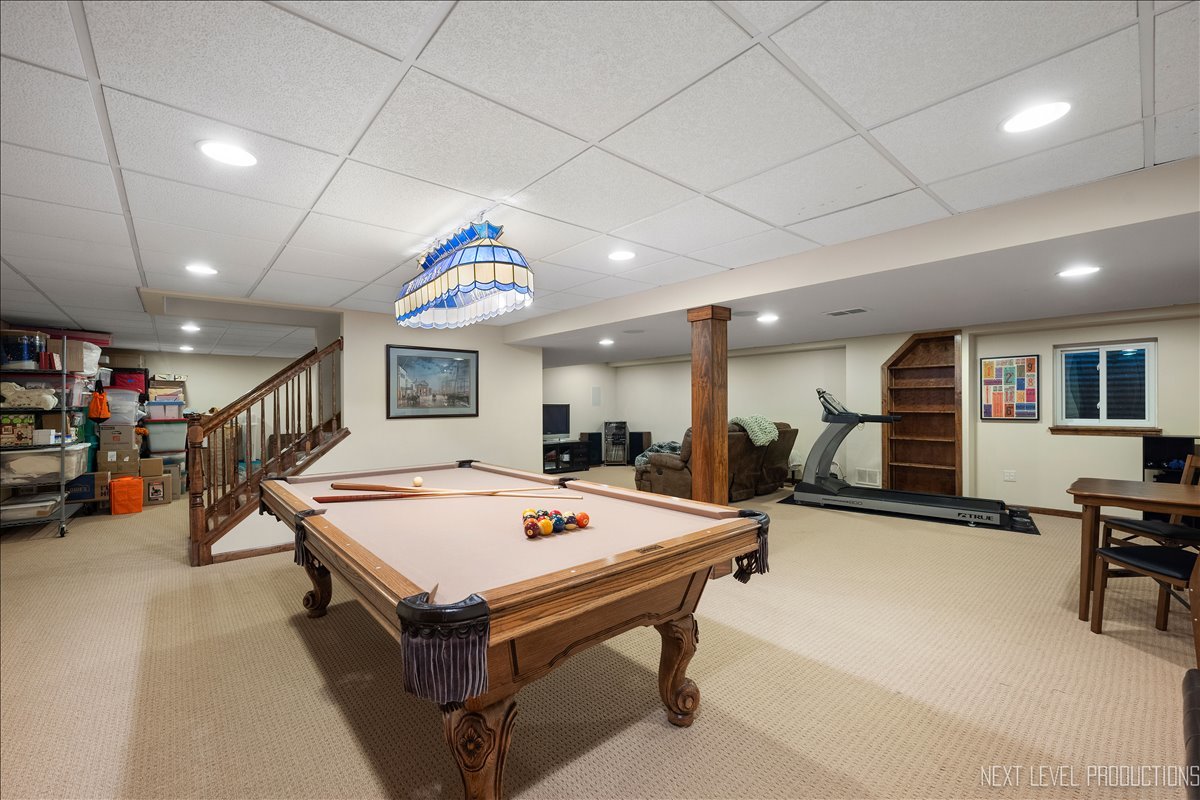 912 Turnbridge Circle Naperville, IL 60540 - Photo 31 of 34 a room with lots of furniture and a table