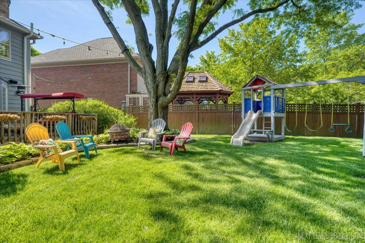 912 Turnbridge Circle Naperville, IL 60540 - Photo 33 of 34 a view of a house with a yard table and chairs