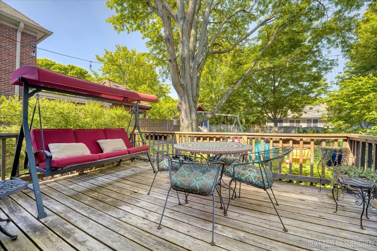 912 Turnbridge Circle Naperville, IL 60540 - Photo 34 of 34 a view of a deck with chairs and wooden floor