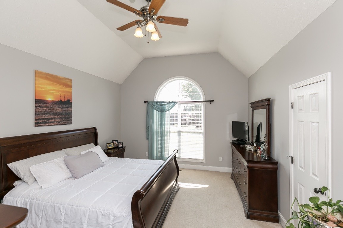 1209 Substation Road Pleasant View, TN 37146 - Photo 14 of 47 a bedroom with a bed and a chandelier