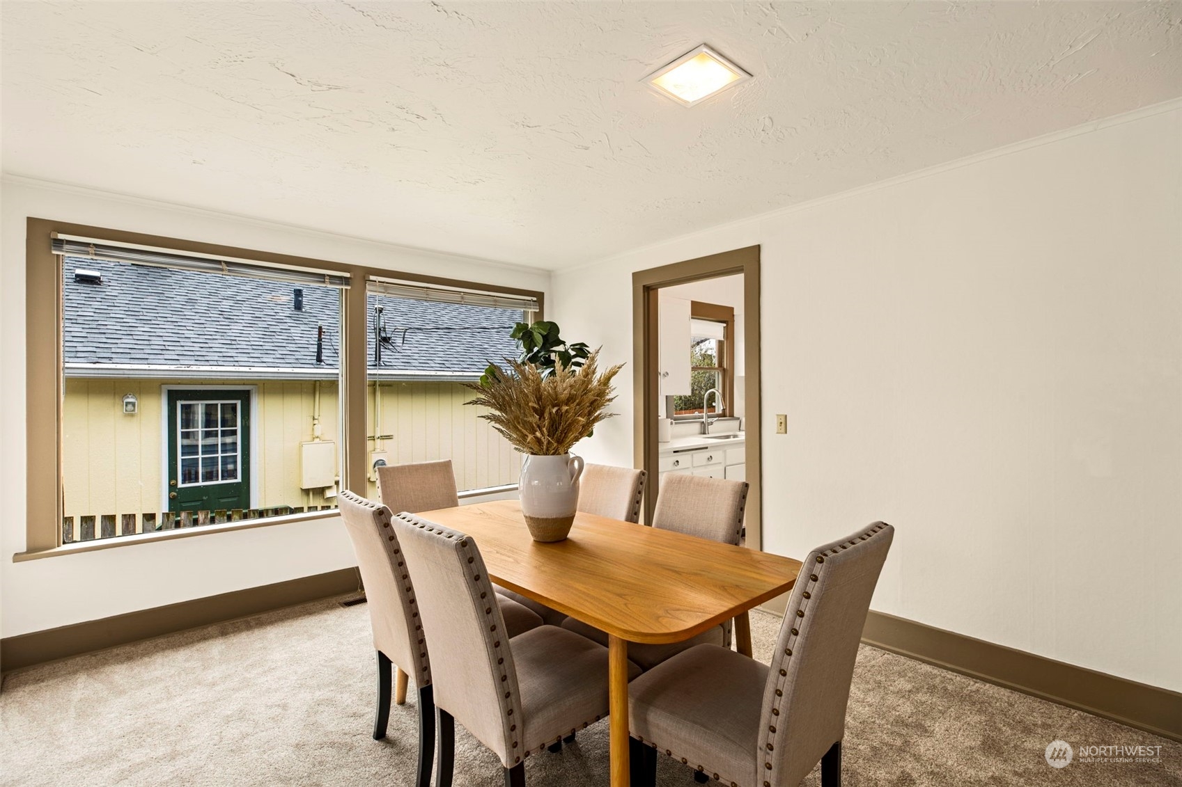 3416 Rockefeller Avenue Everett, WA 98201 - Photo 11 of 40 a view of a dining room with furniture and wooden floor