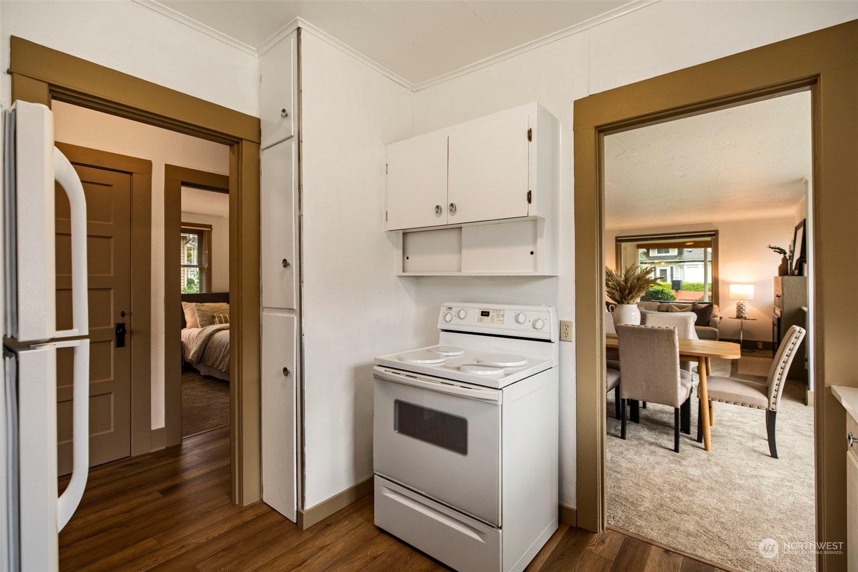 3416 Rockefeller Avenue Everett, WA 98201 - Photo 14 of 40 a kitchen with a refrigerator and white cabinets