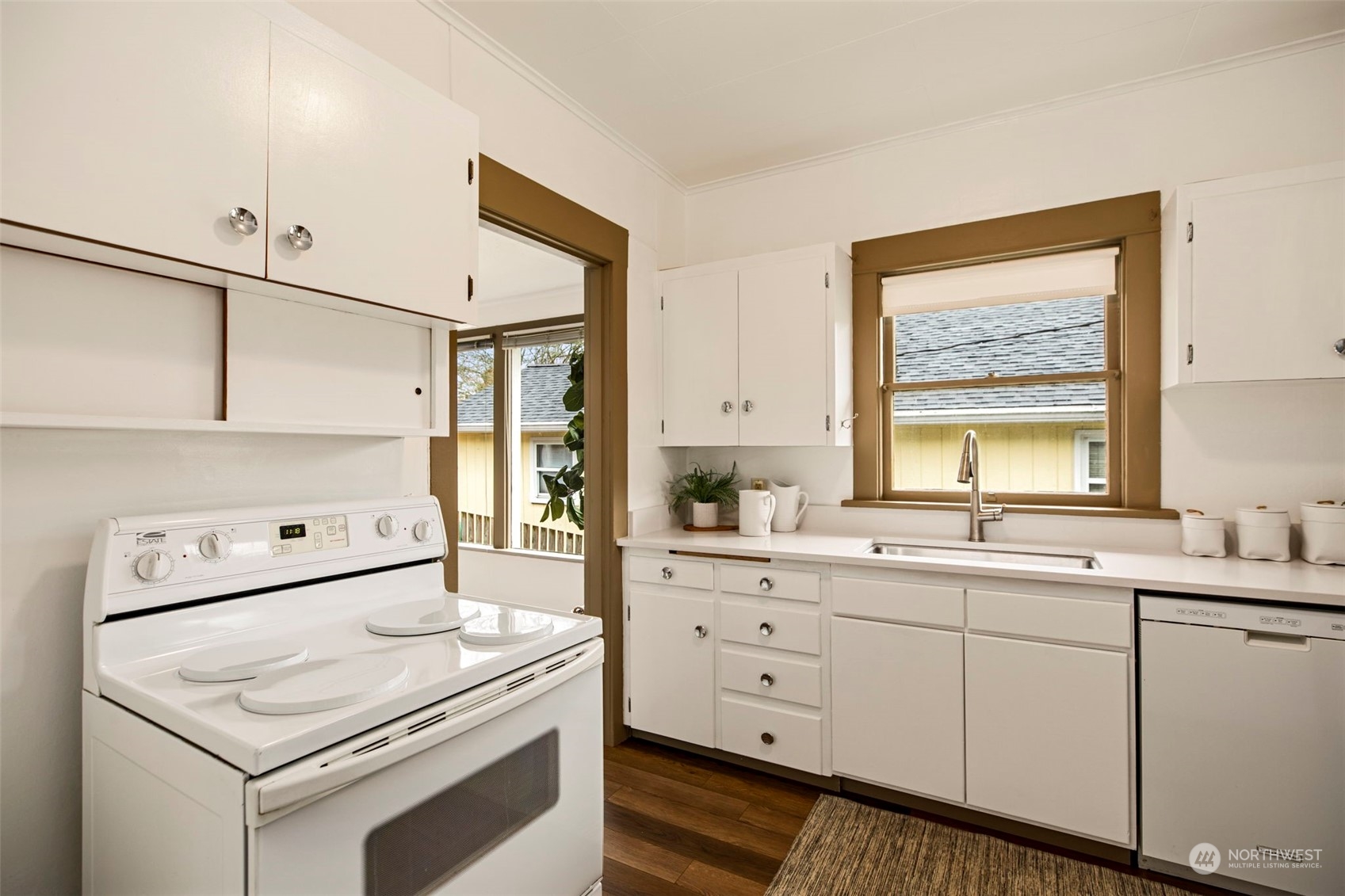 3416 Rockefeller Avenue Everett, WA 98201 - Photo 17 of 40 a kitchen with white cabinets and white appliances