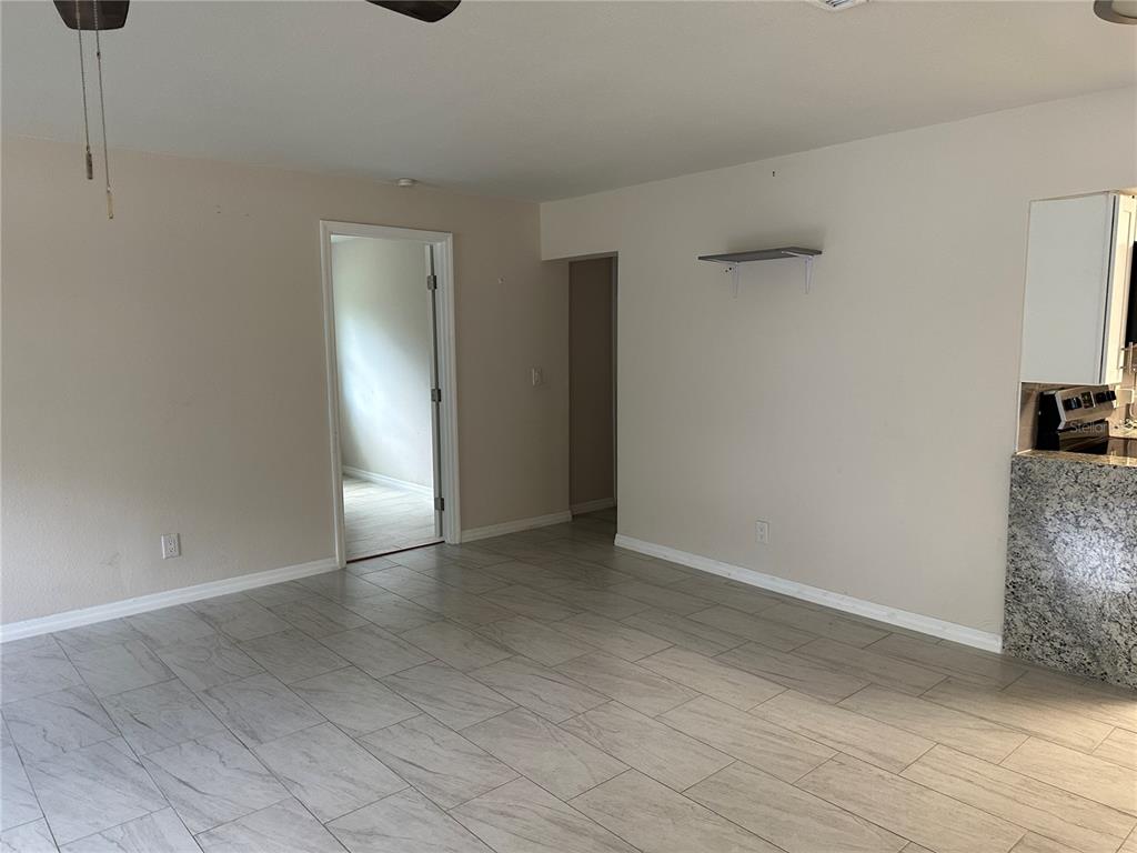 15921 Breakwater Lane Spring Hill, FL 34610 - Photo 12 of 26 a view of an empty room and wooden floor