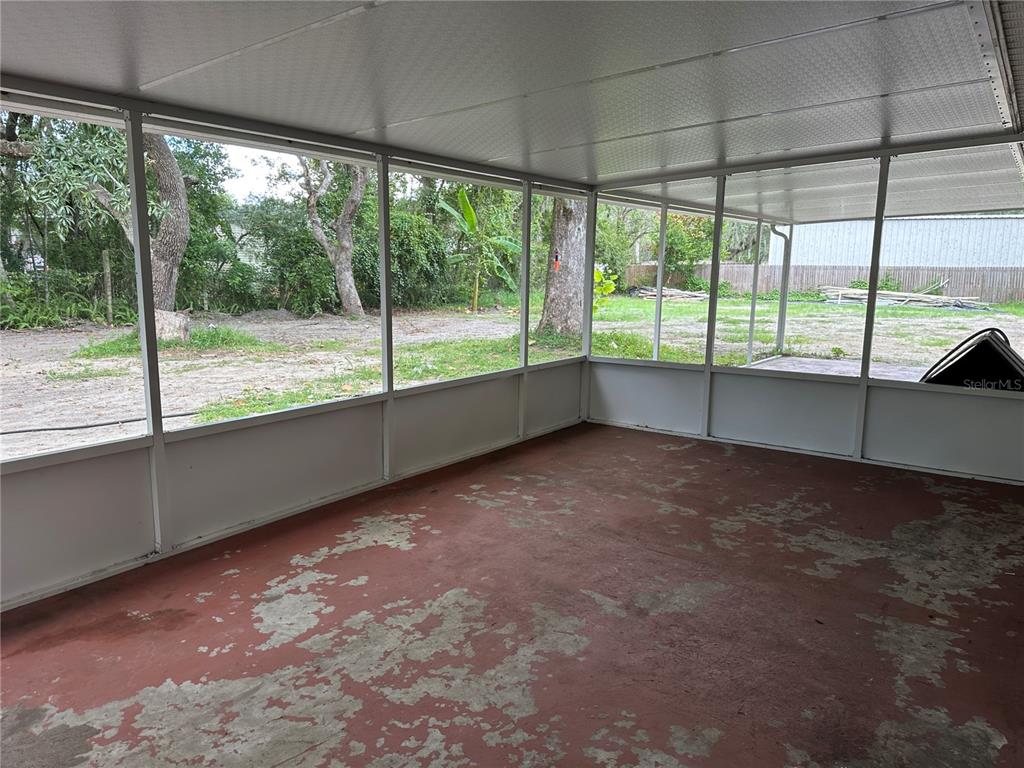 15921 Breakwater Lane Spring Hill, FL 34610 - Photo 22 of 26 a view of an empty room with a large window