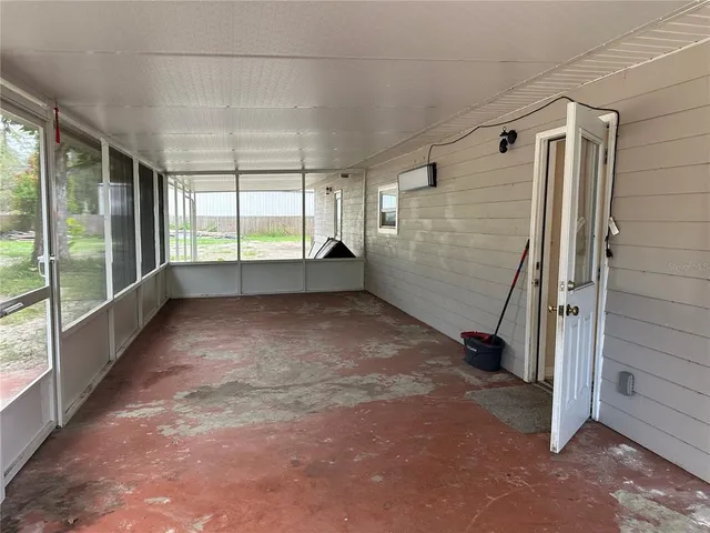 a view of empty room with windows