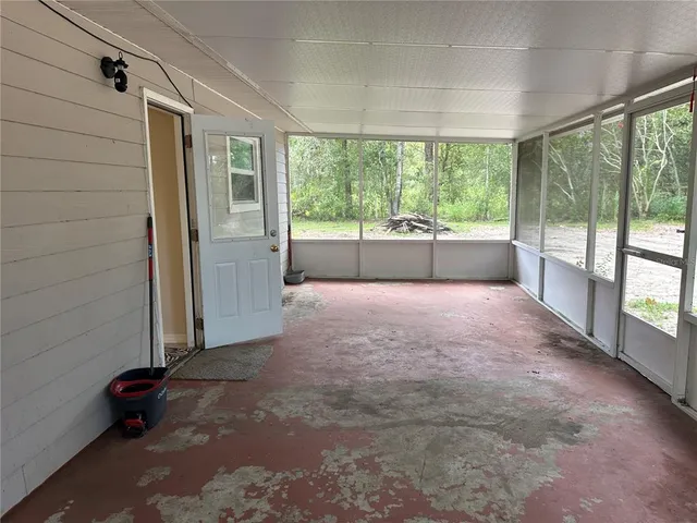 a view of empty room with front door