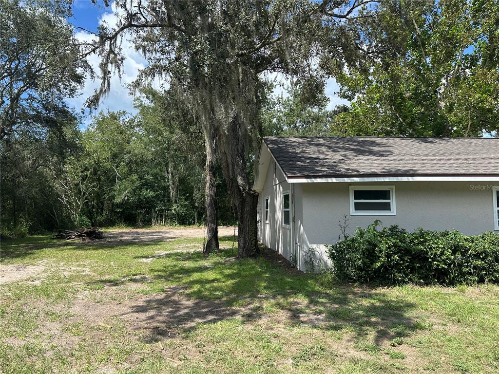 15921 Breakwater Lane Spring Hill, FL 34610 - Photo 4 of 26 a view of a house with a backyard