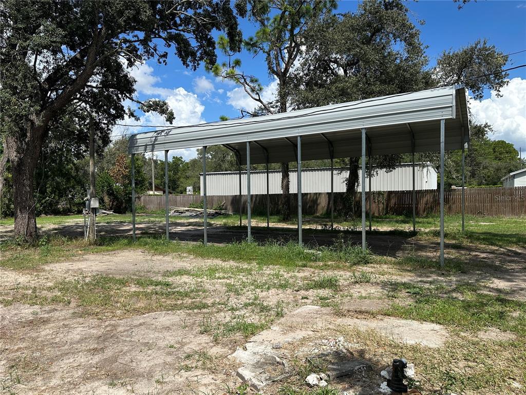 15921 Breakwater Lane Spring Hill, FL 34610 - Photo 5 of 26 a view of a backyard with large trees
