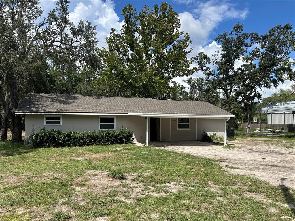 15921 Breakwater Lane Spring Hill, FL 34610 - Photo 6 of 26 front view of house with a yard