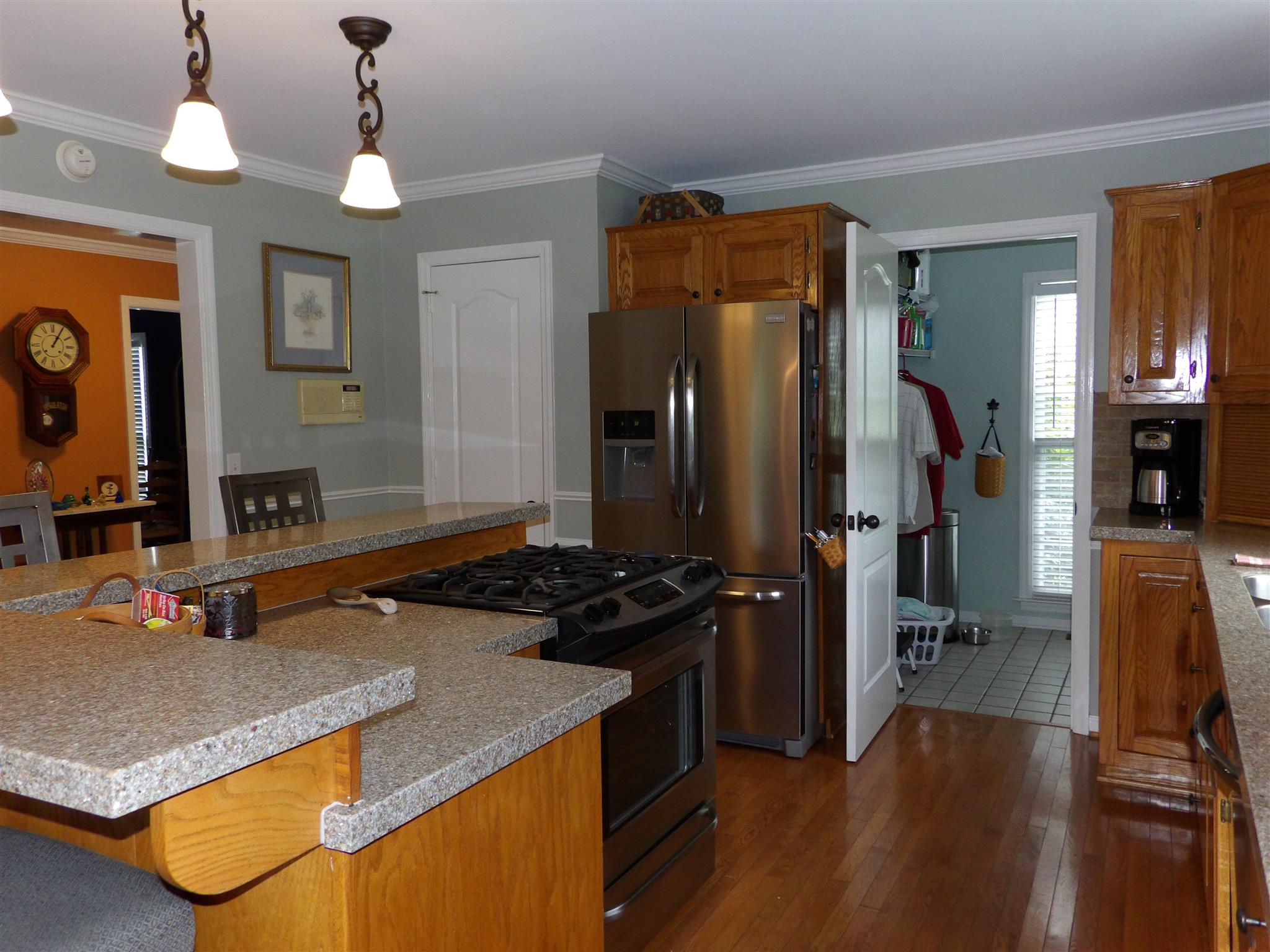 197 Spicer Road Burns, TN 37029 - Photo 12 of 28 a kitchen that has a lot of cabinets and stainless steel appliances