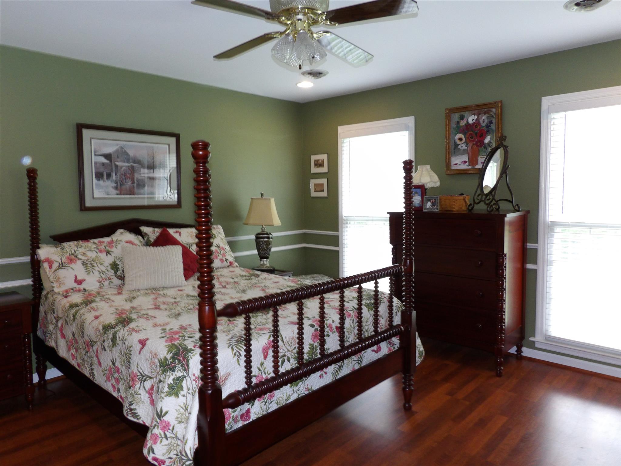 197 Spicer Road Burns, TN 37029 - Photo 16 of 28 a bed sitting in a bedroom next to a window