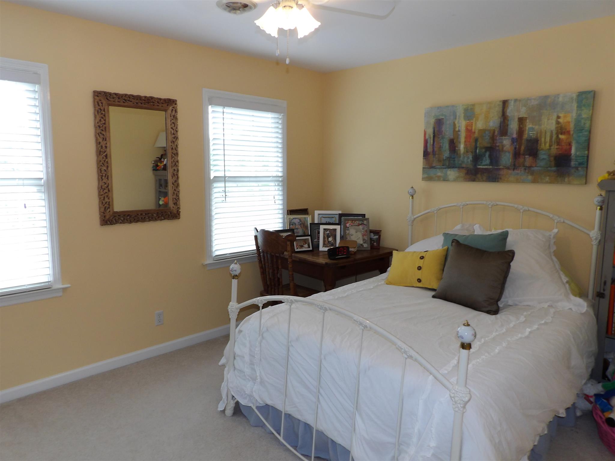 197 Spicer Road Burns, TN 37029 - Photo 20 of 28 a bed sitting in a bedroom next to a window