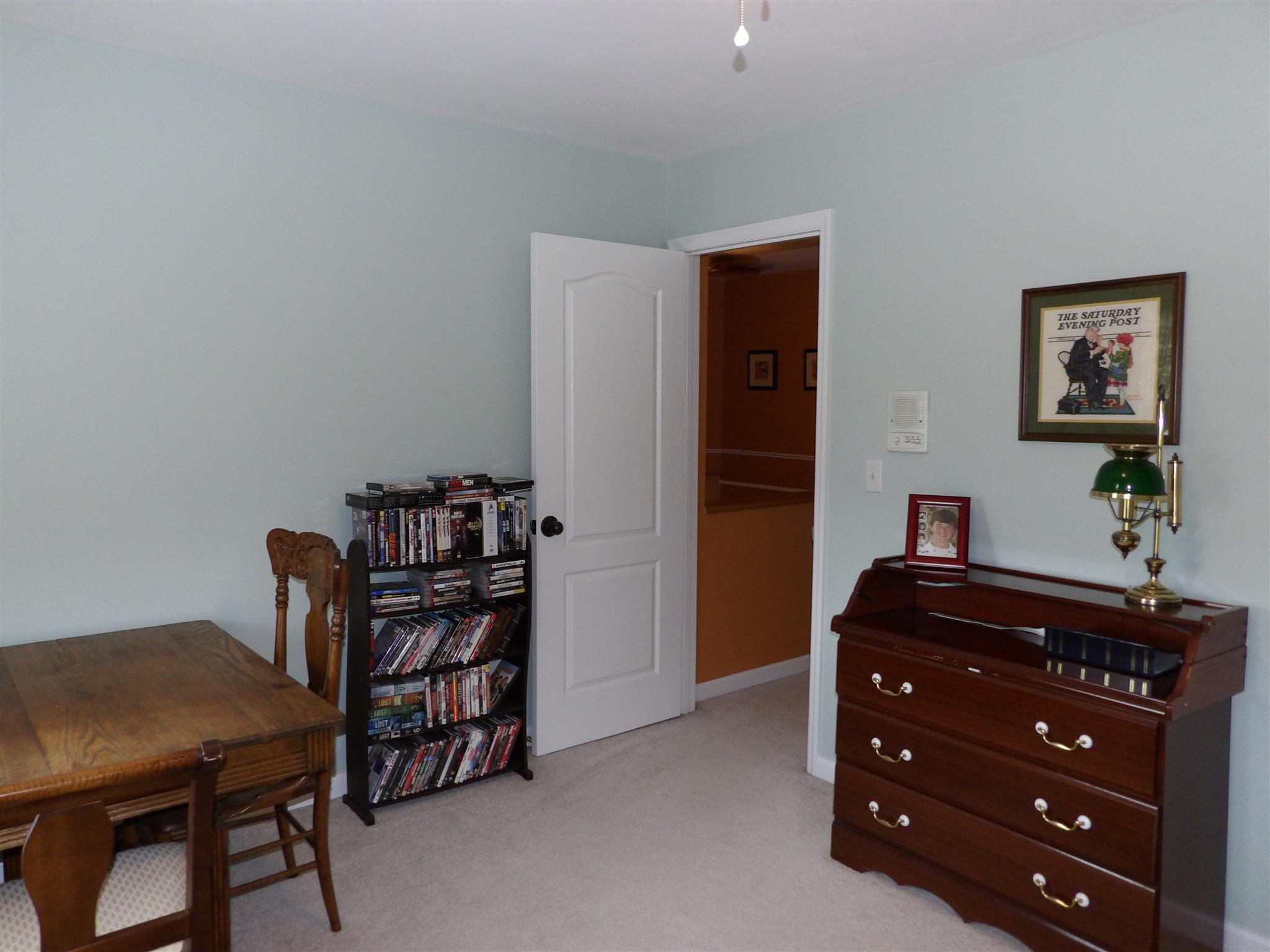 197 Spicer Road Burns, TN 37029 - Photo 23 of 28 a room with a table and a bookshelf