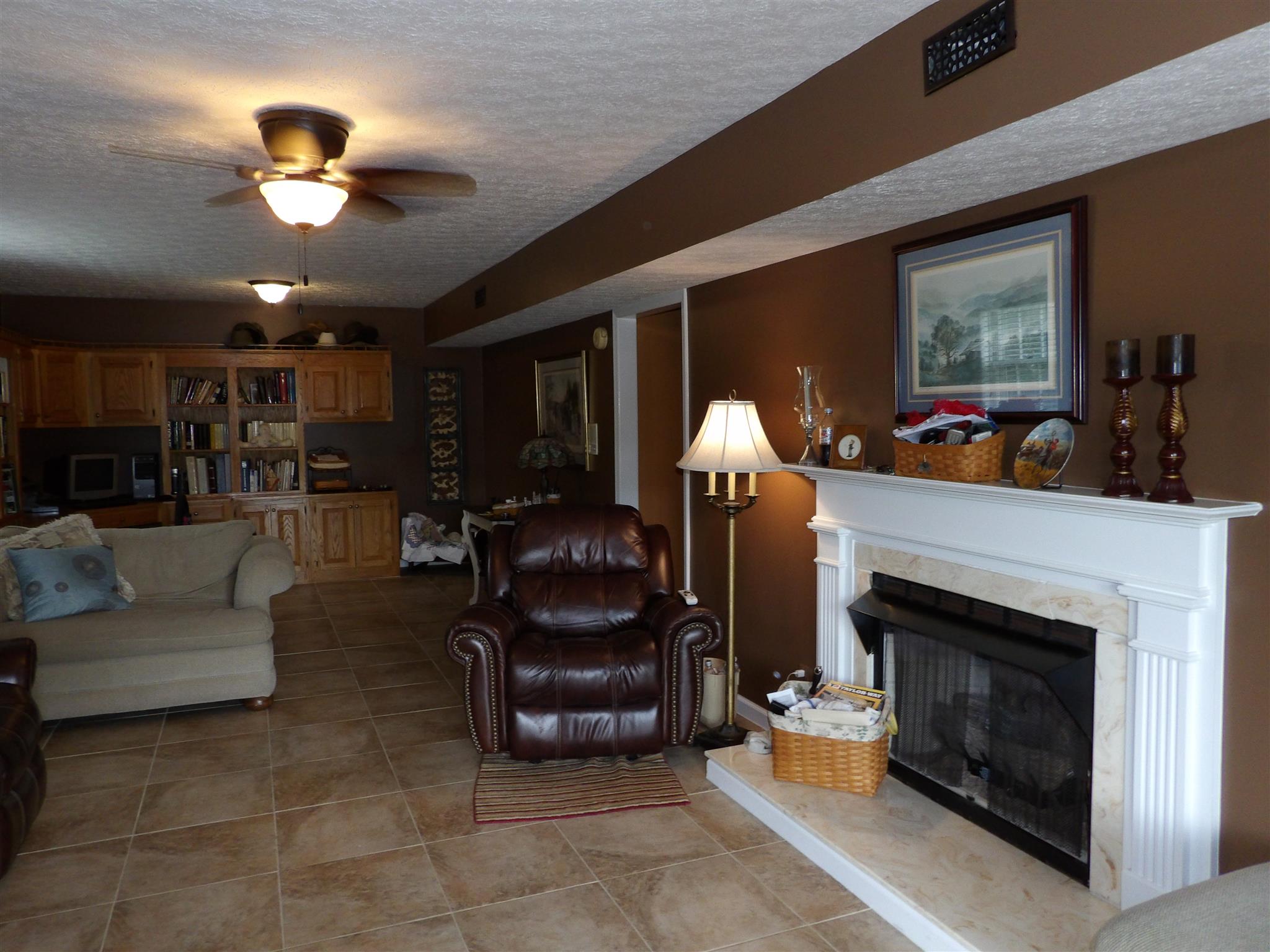197 Spicer Road Burns, TN 37029 - Photo 26 of 28 a living room with furniture and a fireplace