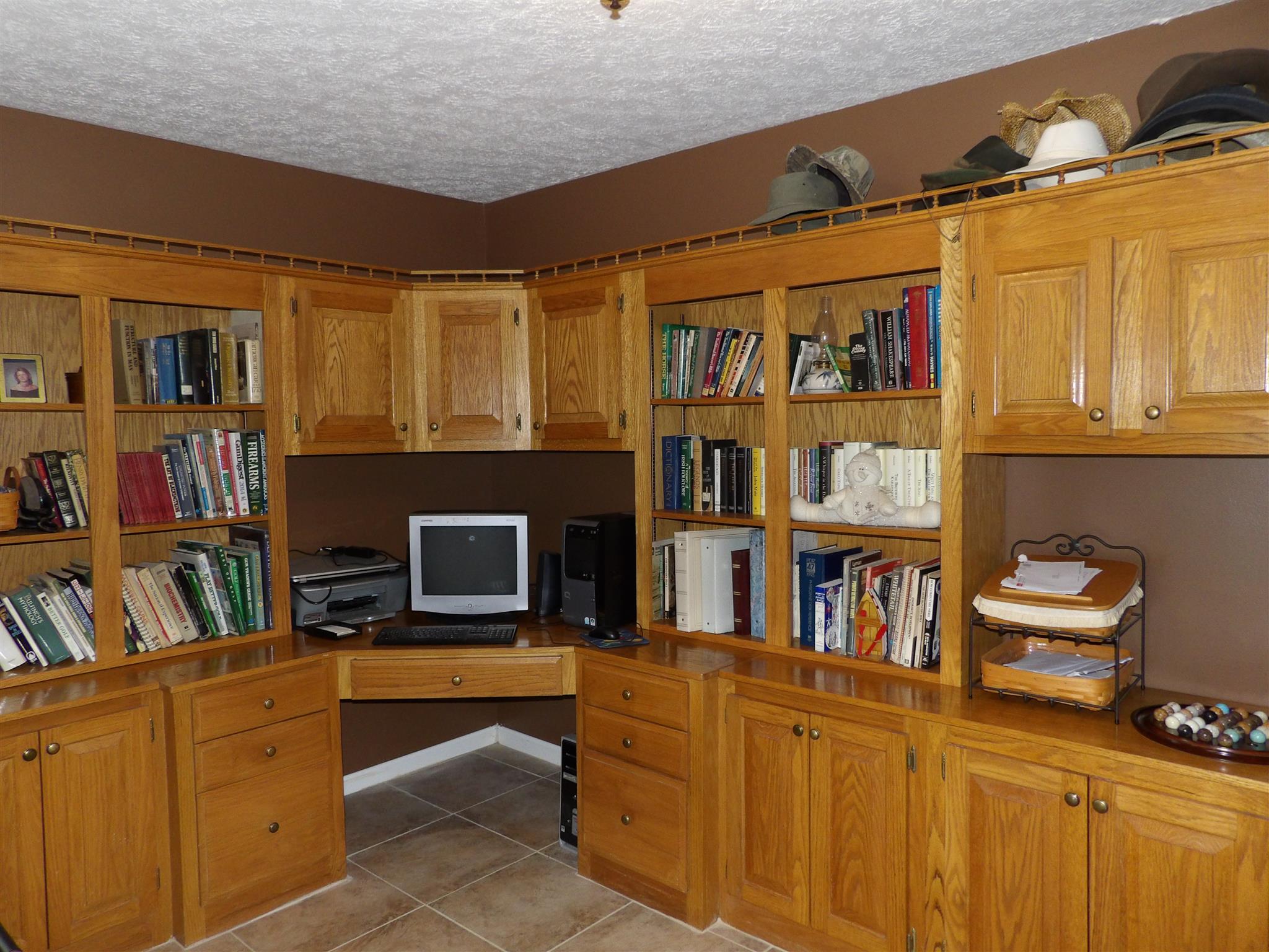 197 Spicer Road Burns, TN 37029 - Photo 28 of 28 a living room with furniture cabinets and a fireplace