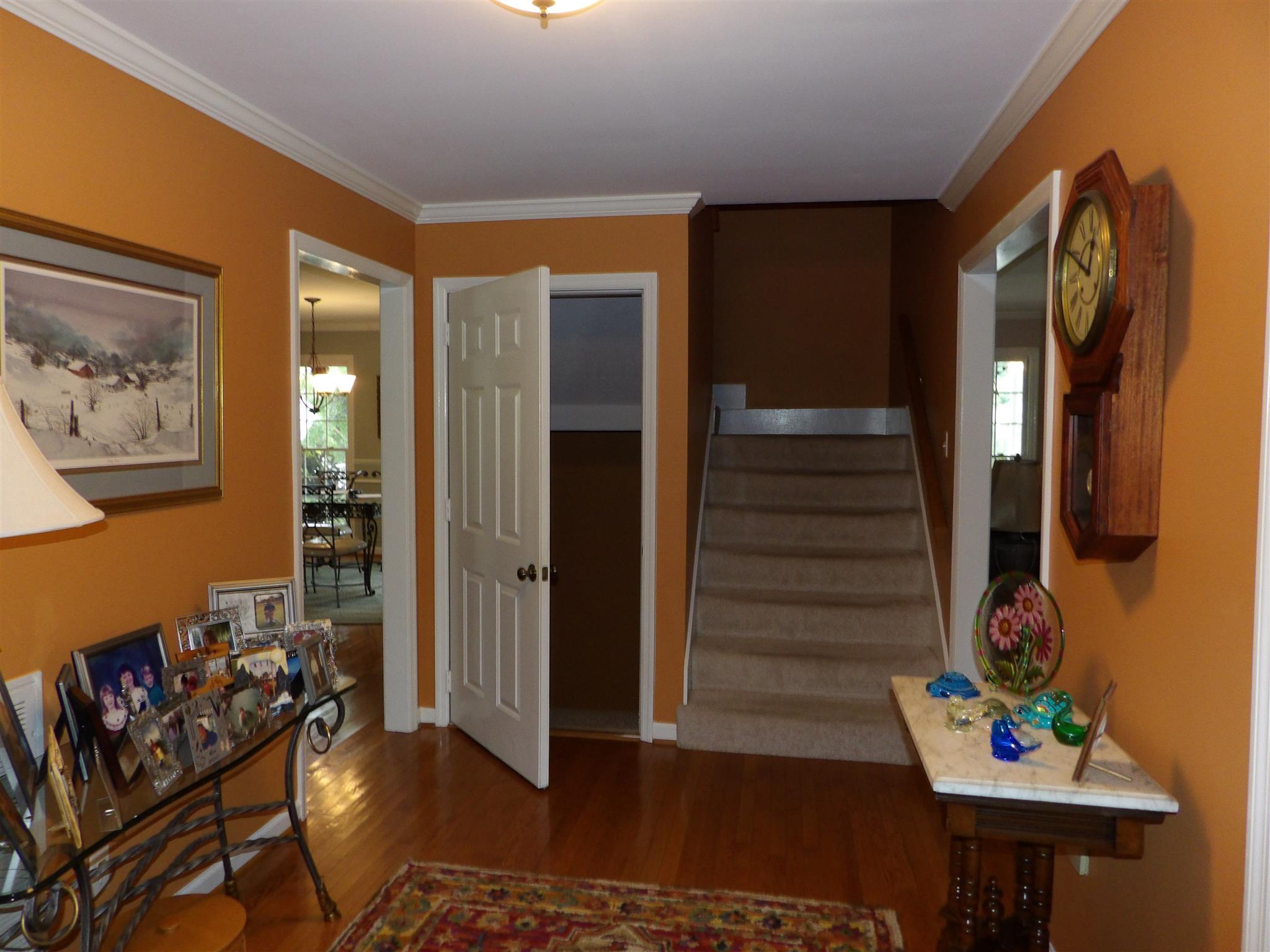 197 Spicer Road Burns, TN 37029 - Photo 8 of 28 a view of a hallway with wooden floor and furniture