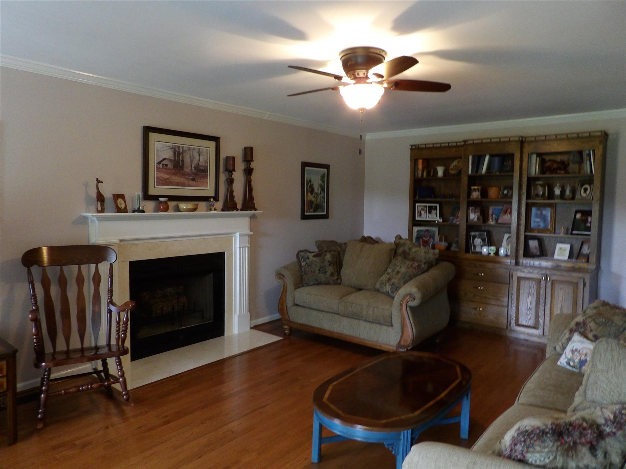197 Spicer Road Burns, TN 37029 - Photo 10 of 28 a living room with furniture a lamp and a fireplace