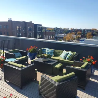 a view of a balcony with furniture