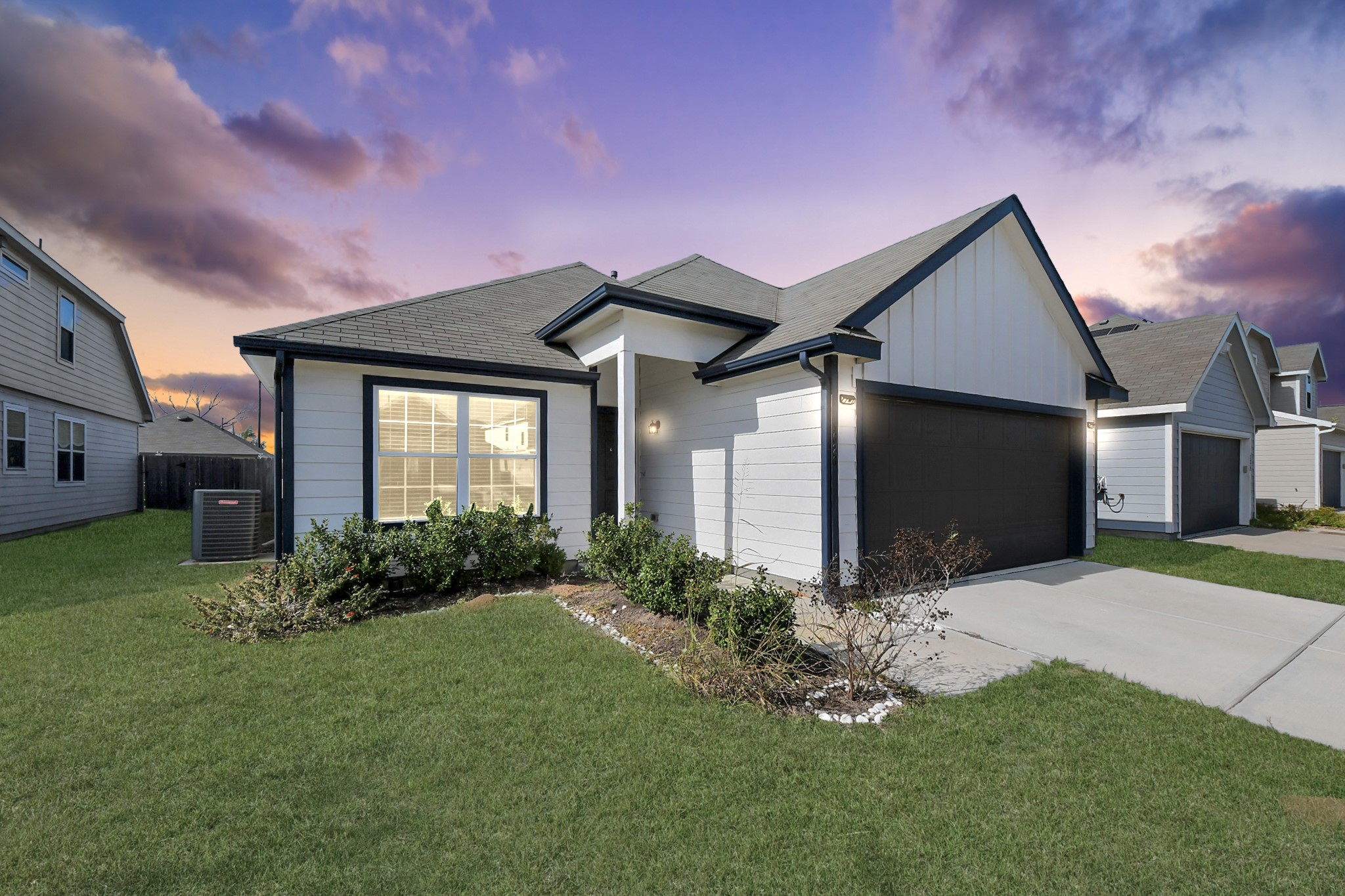 a front view of a house with garden