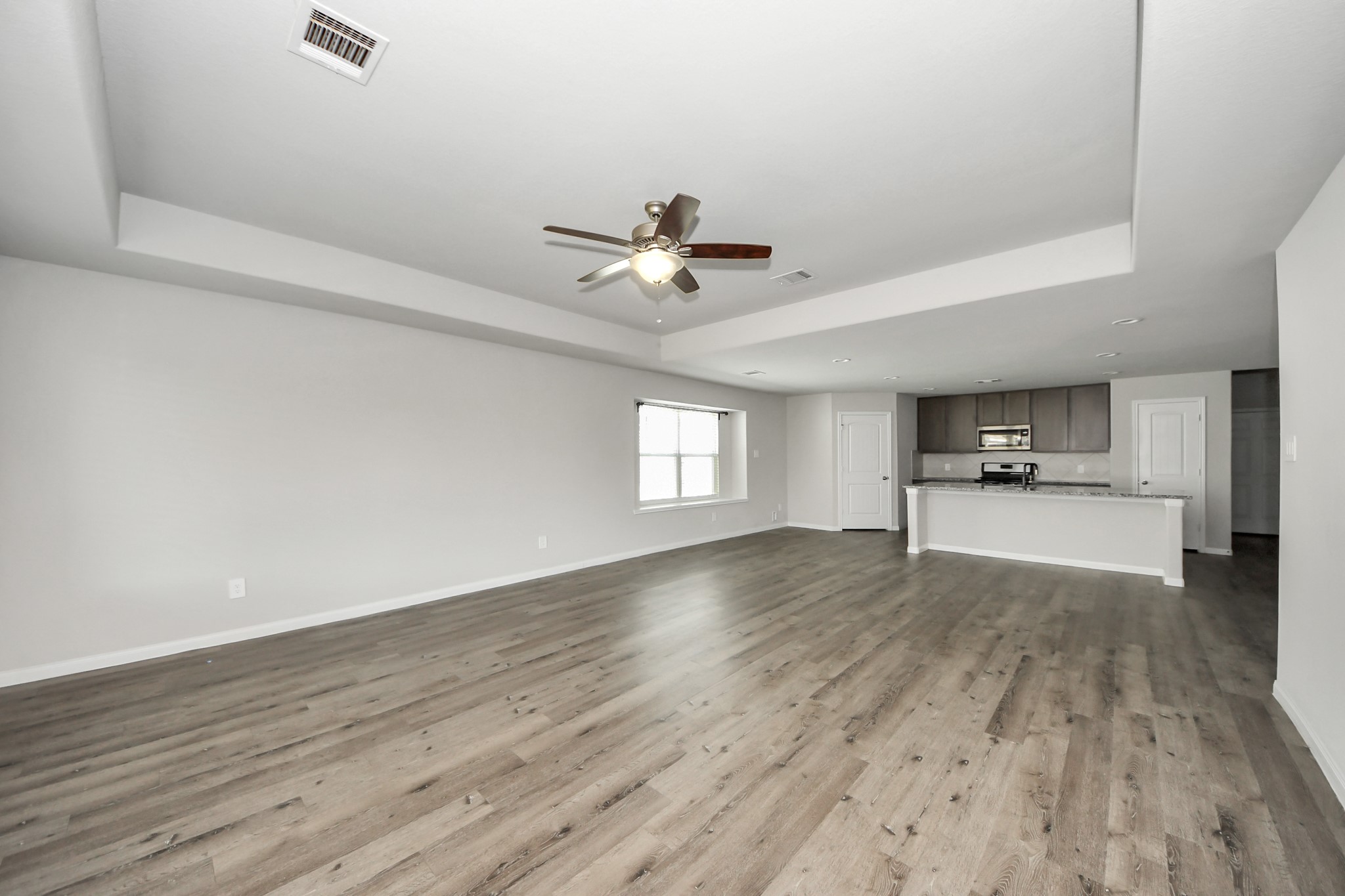 5626 Brooklyn Rose Drive Rosharon, TX 77583 - Photo 15 of 34 wooden floor in an empty room with a window