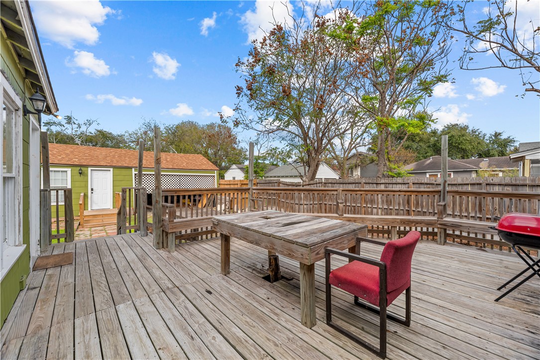 438 Indiana Avenue Corpus Christi, TX 78404 - Photo 8 of 8 a view of a balcony with wooden floor and outdoor seating