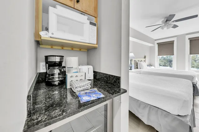 a kitchen with a stove and a white cabinets