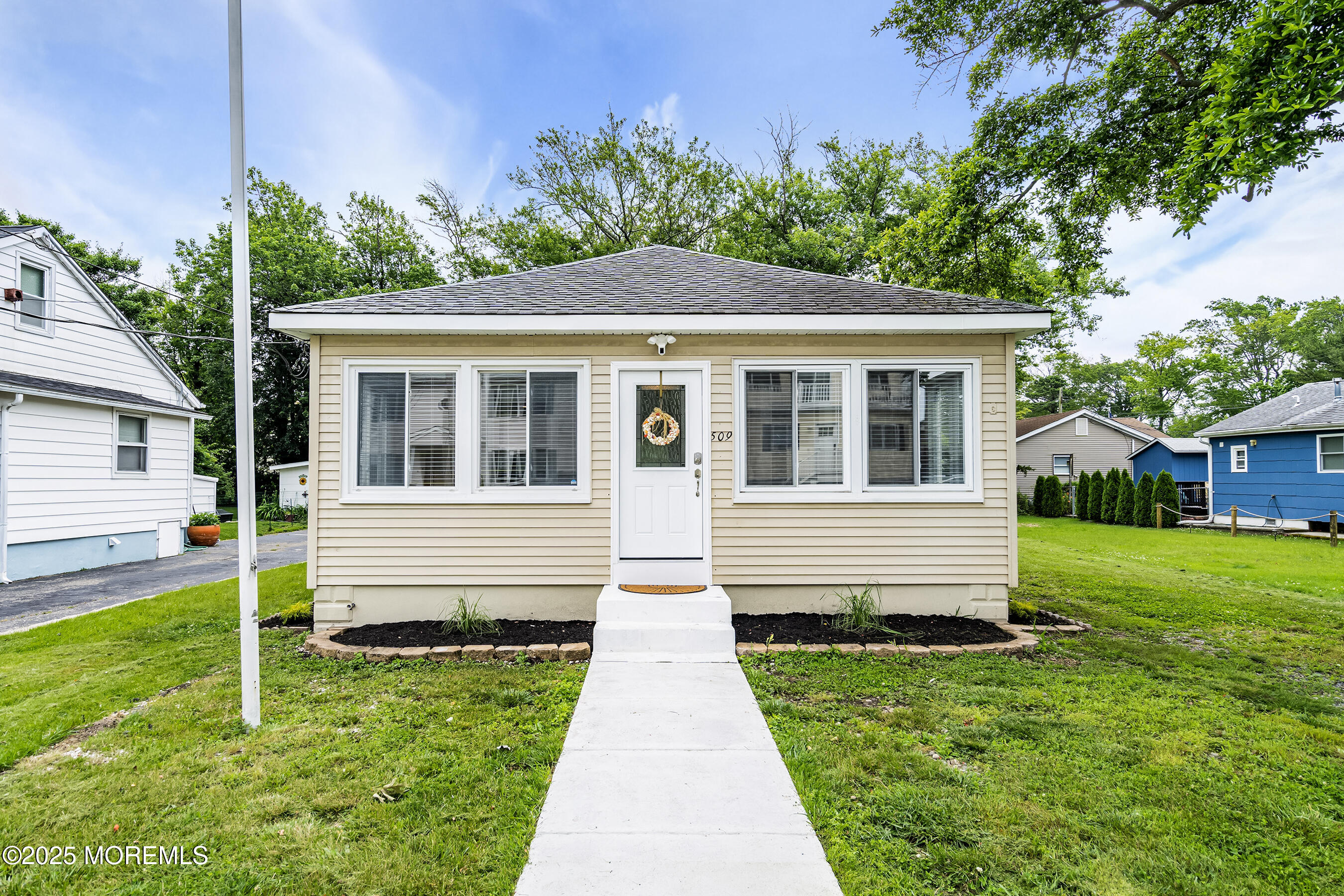 a front view of a house with a yard