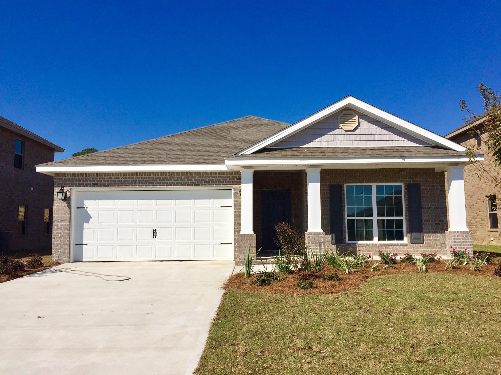 234 Pin Oak Loop Santa Rosa Beach, FL 32459 - Photo 2 of 22 a front view of a house with garden