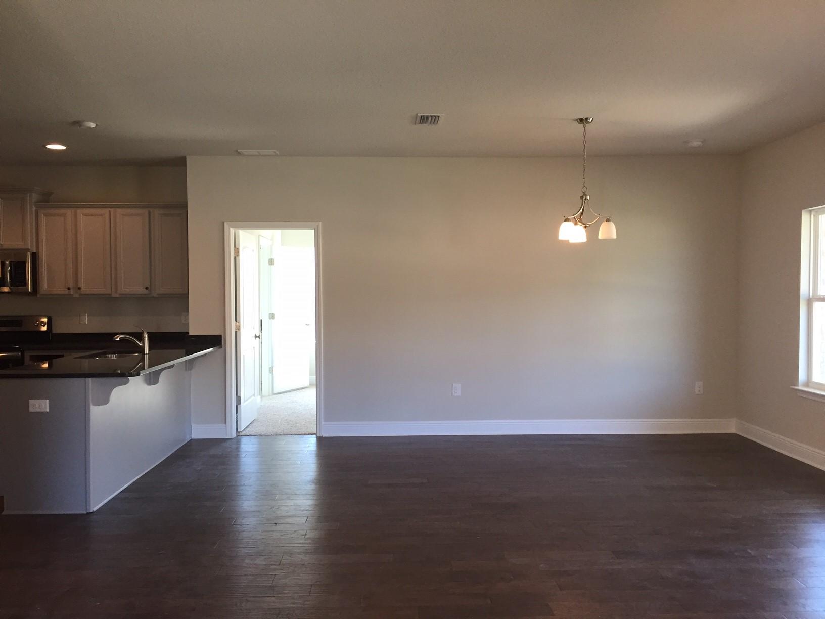 234 Pin Oak Loop Santa Rosa Beach, FL 32459 - Photo 11 of 22 an empty room with wooden floor and window