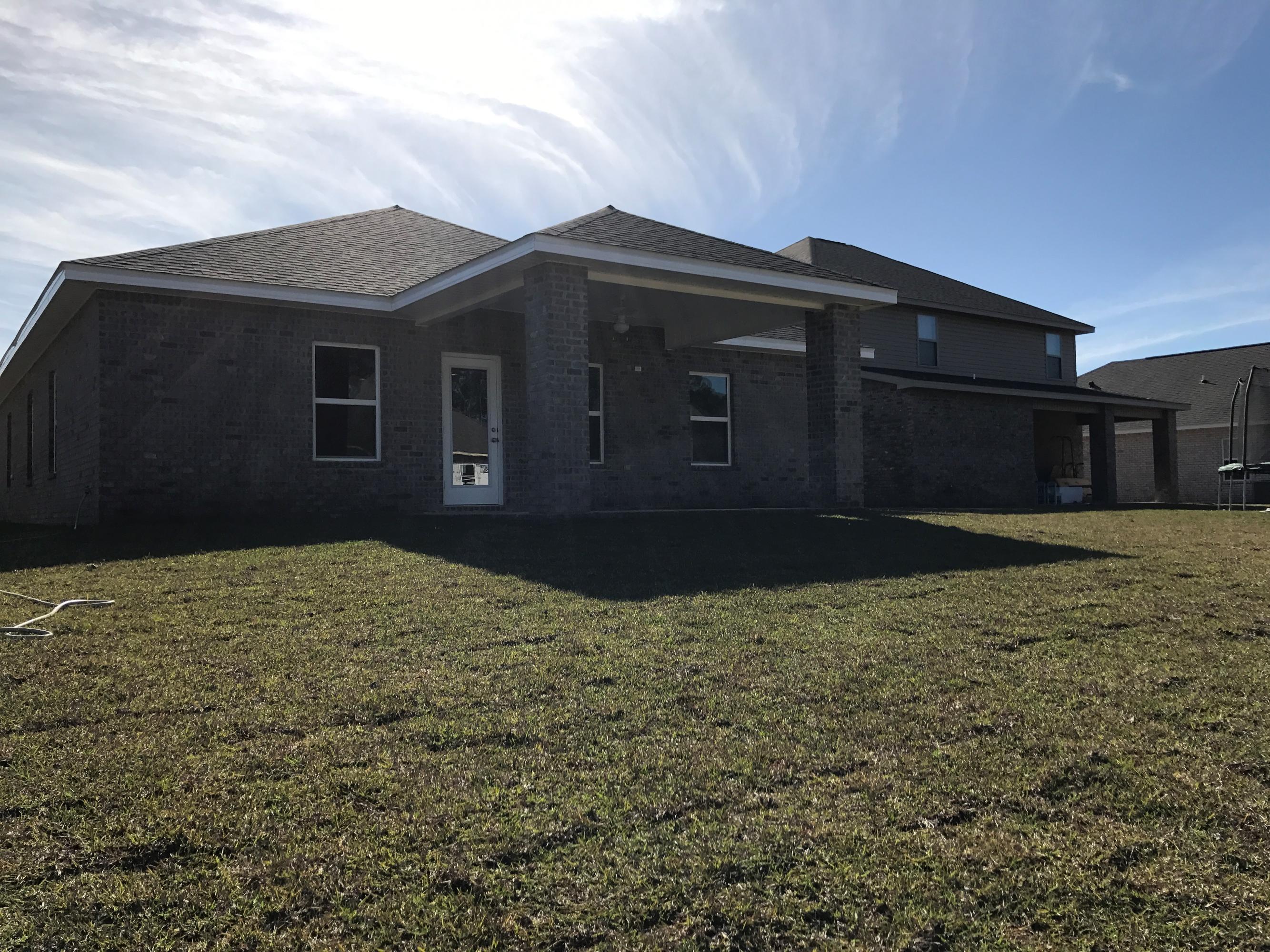 234 Pin Oak Loop Santa Rosa Beach, FL 32459 - Photo 20 of 22 a front view of a house