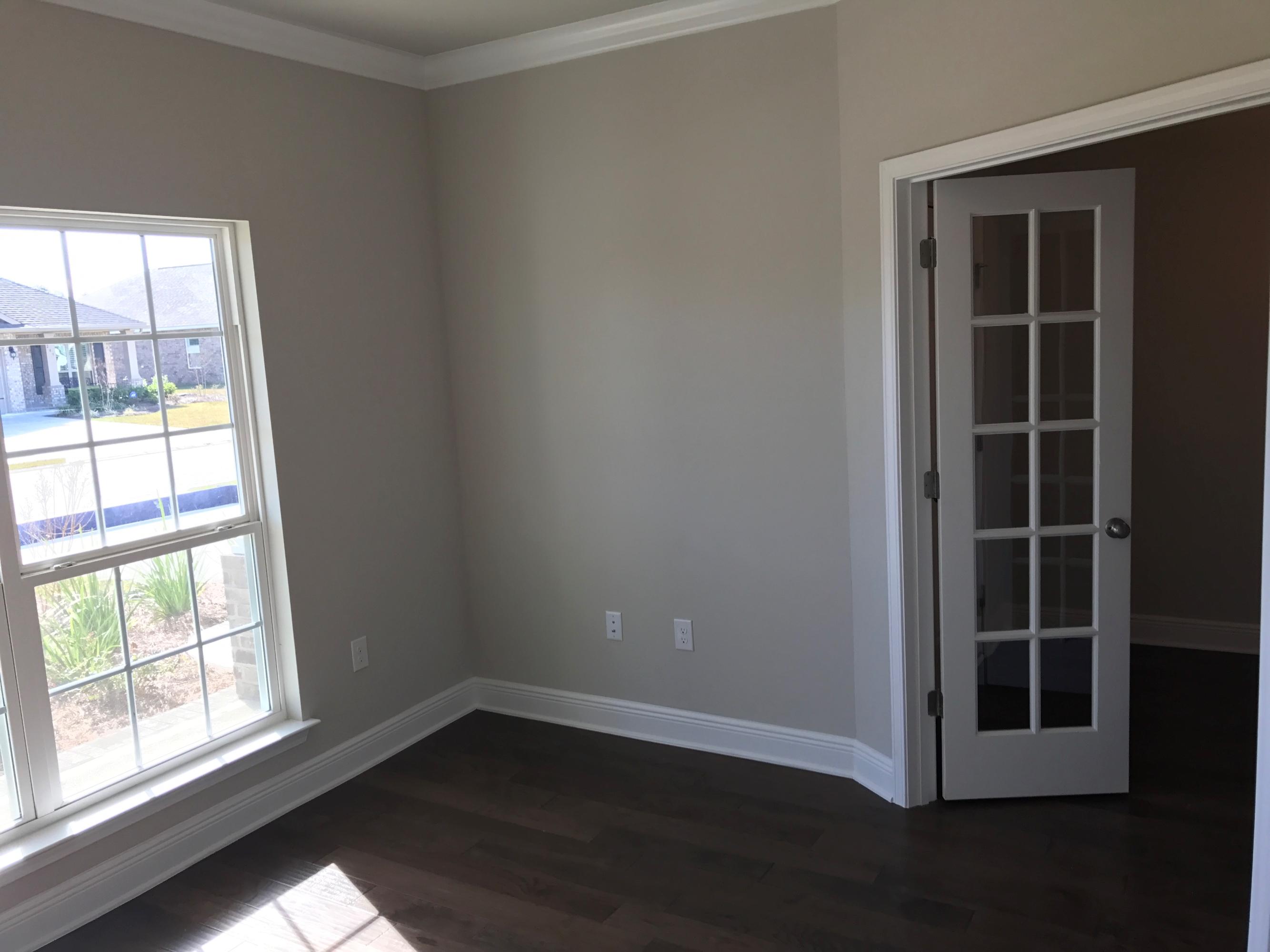 234 Pin Oak Loop Santa Rosa Beach, FL 32459 - Photo 4 of 22 an empty room with wooden floor and windows