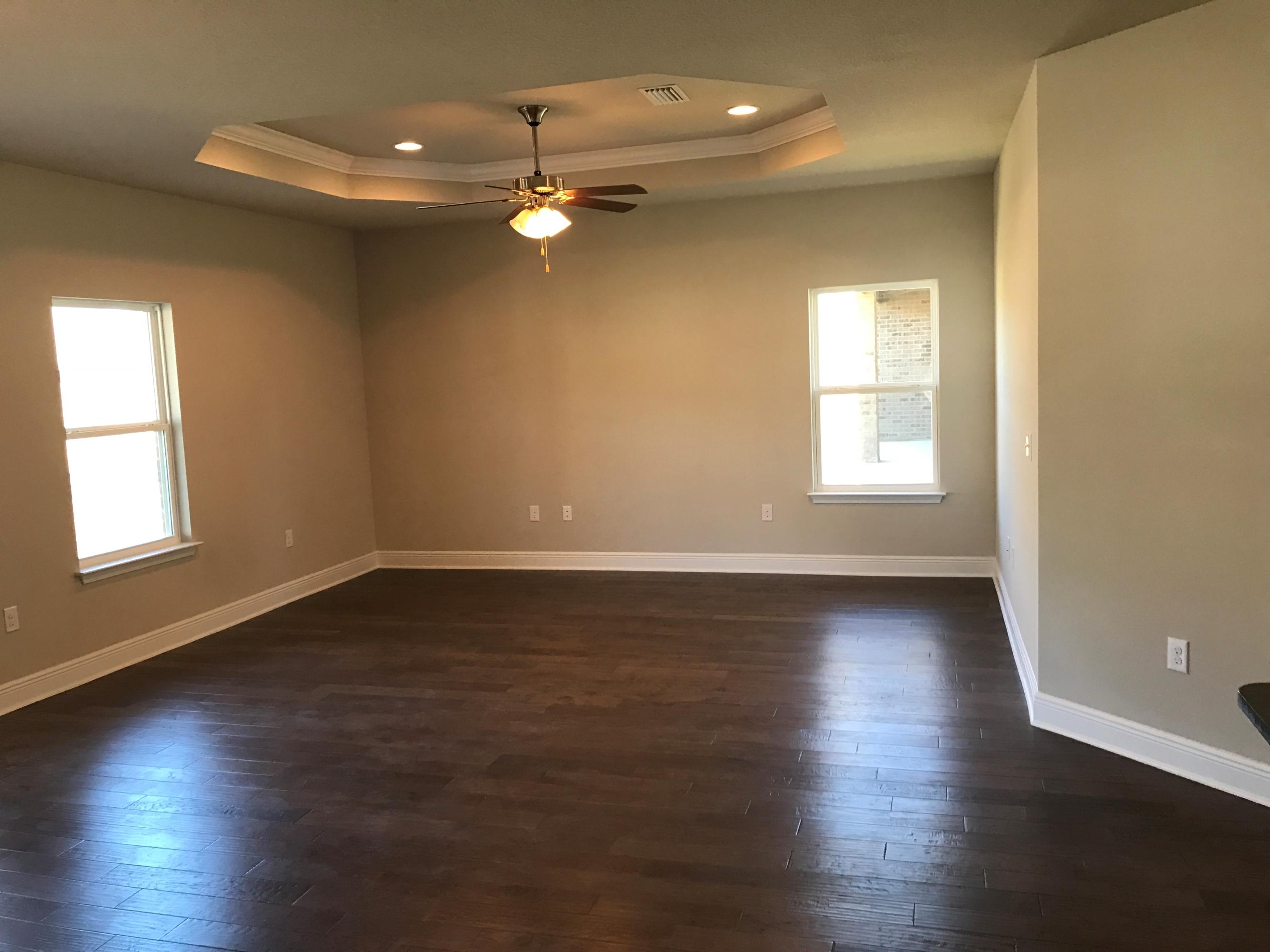 234 Pin Oak Loop Santa Rosa Beach, FL 32459 - Photo 9 of 22 an empty room with wooden floor and windows