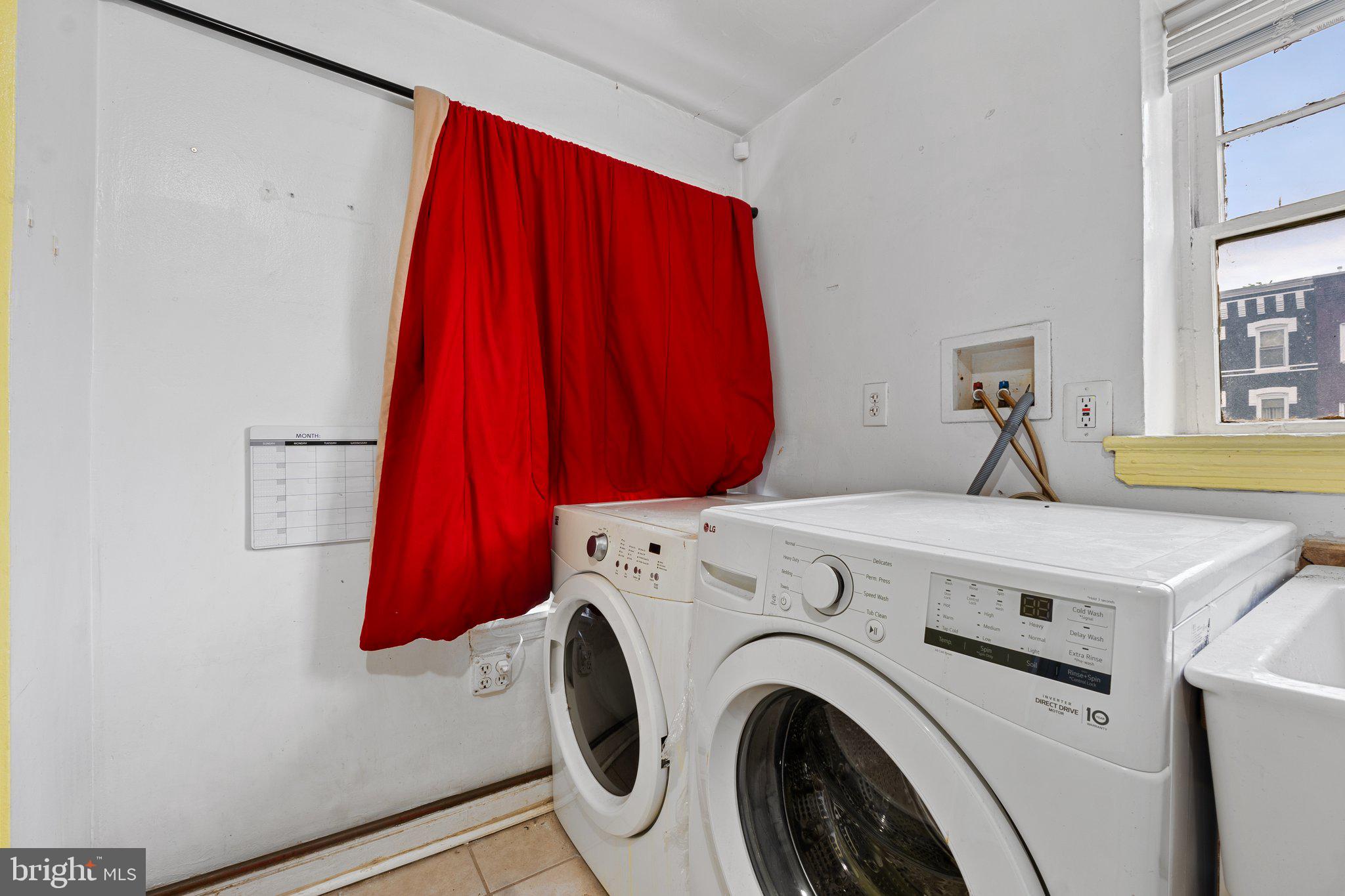 1701 6th Street Northwest Washington, DC 20001 - Photo 12 of 23 a utility room with dryer and washer
