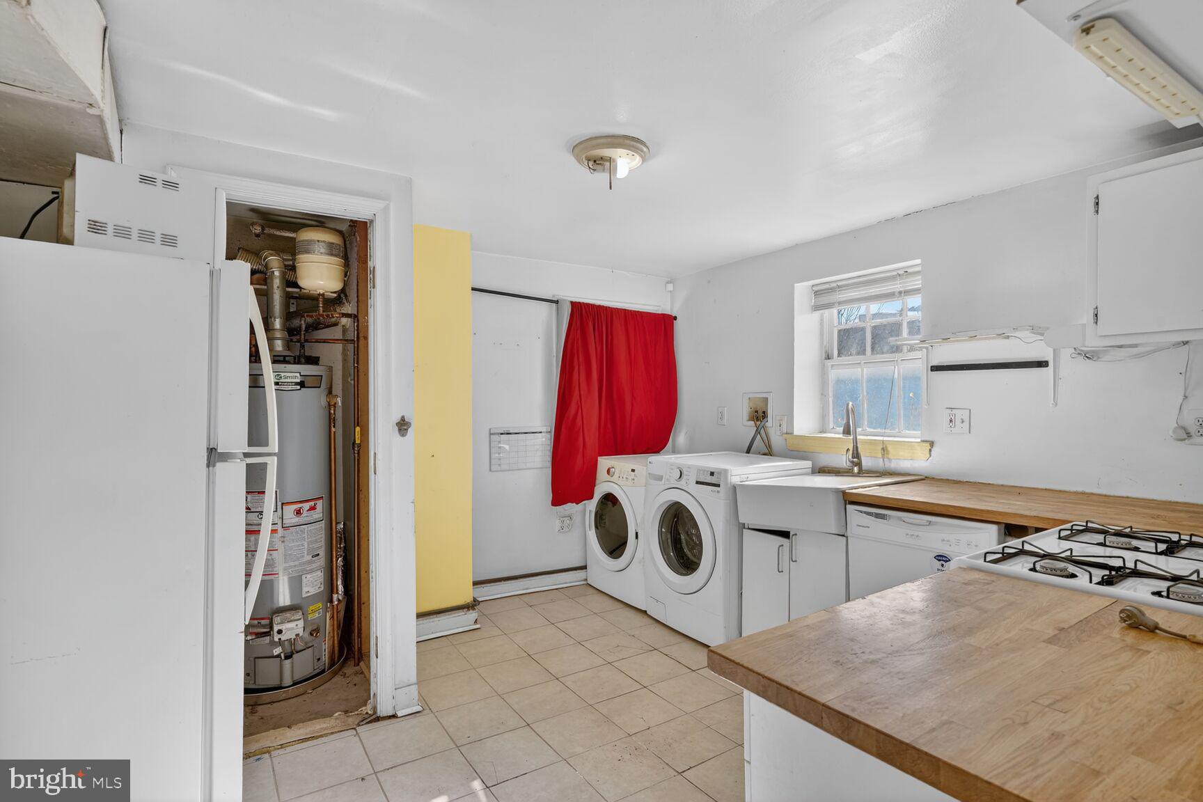 1701 6th Street Northwest Washington, DC 20001 - Photo 18 of 23 a kitchen with a stove a refrigerator and a sink