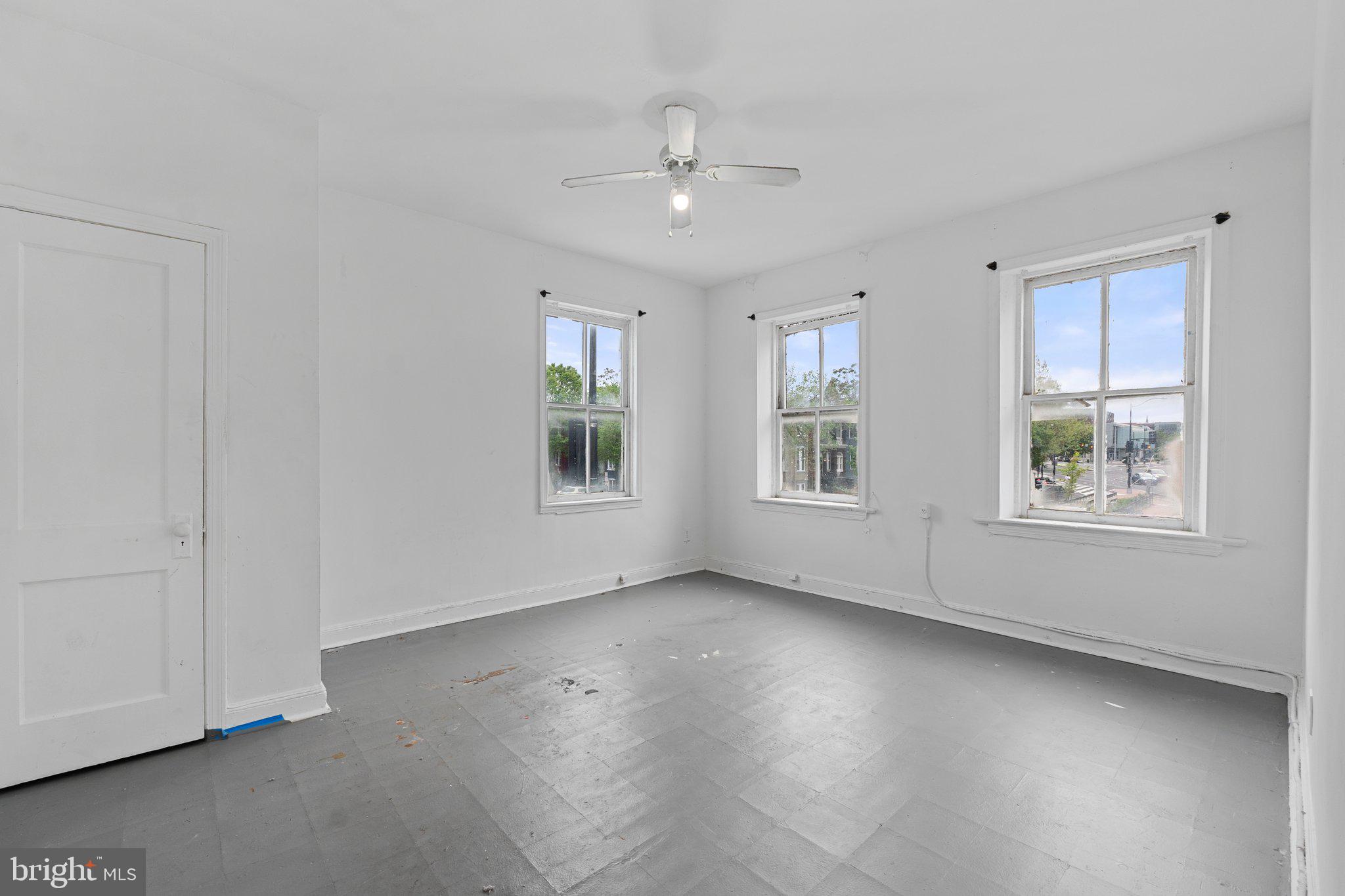 1701 6th Street Northwest Washington, DC 20001 - Photo 7 of 23 a view of an empty room with a window and wooden floor