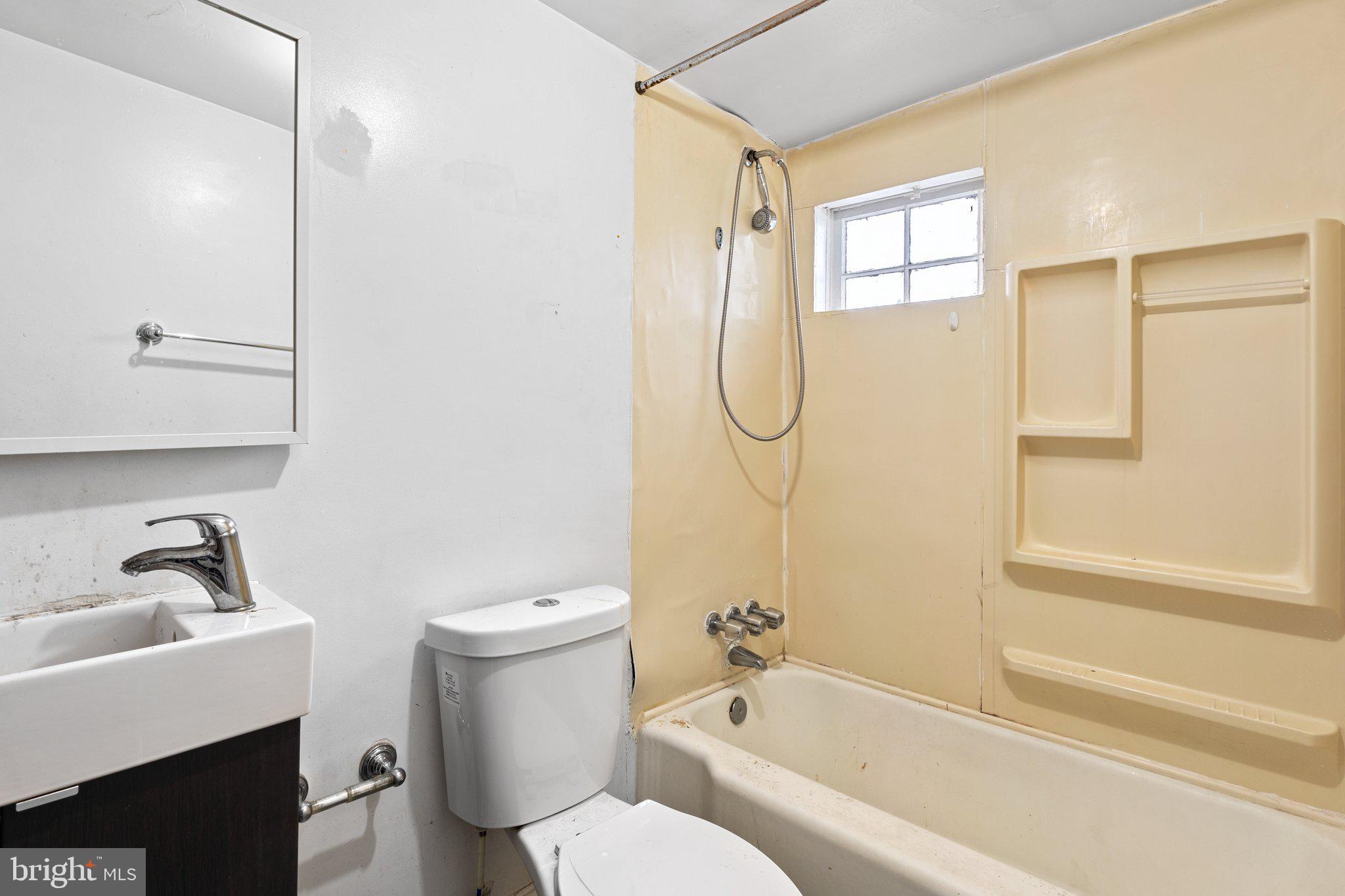 1701 6th Street Northwest Washington, DC 20001 - Photo 8 of 23 a bathroom with a sink a toilet and shower