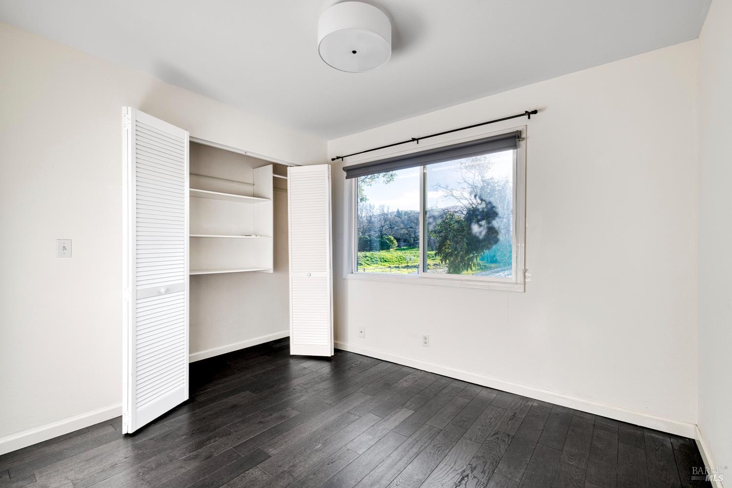 1534 Buchanan Street Novato, CA 94947 - Photo 21 of 30 an empty room with wooden floor and windows