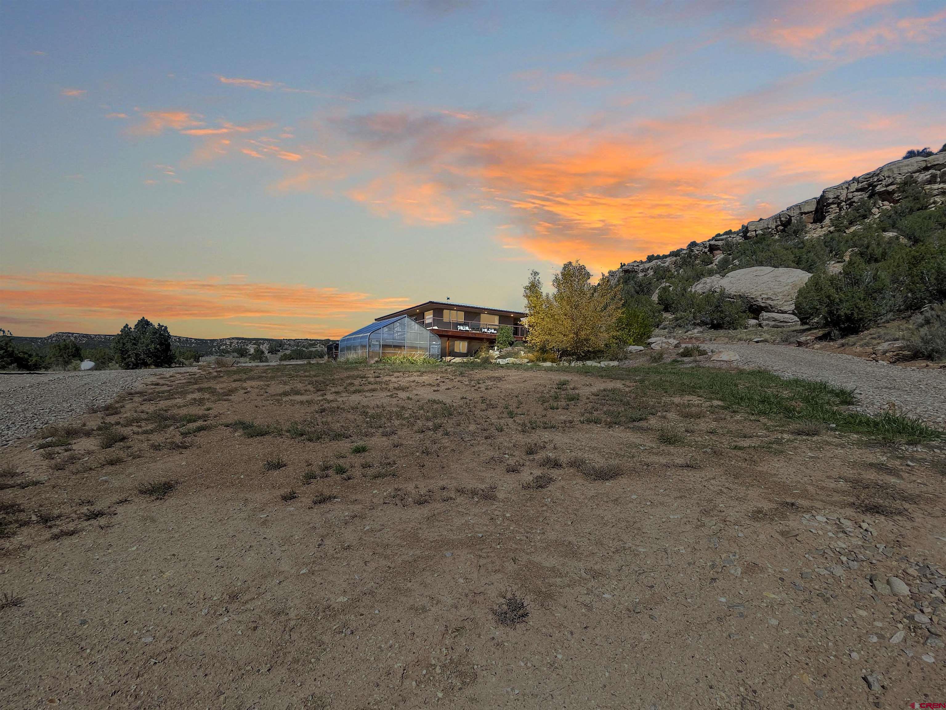 20615 Rd G Cortez, CO 81321 - Photo 12 of 43 a view of a dry yard with wooden fence