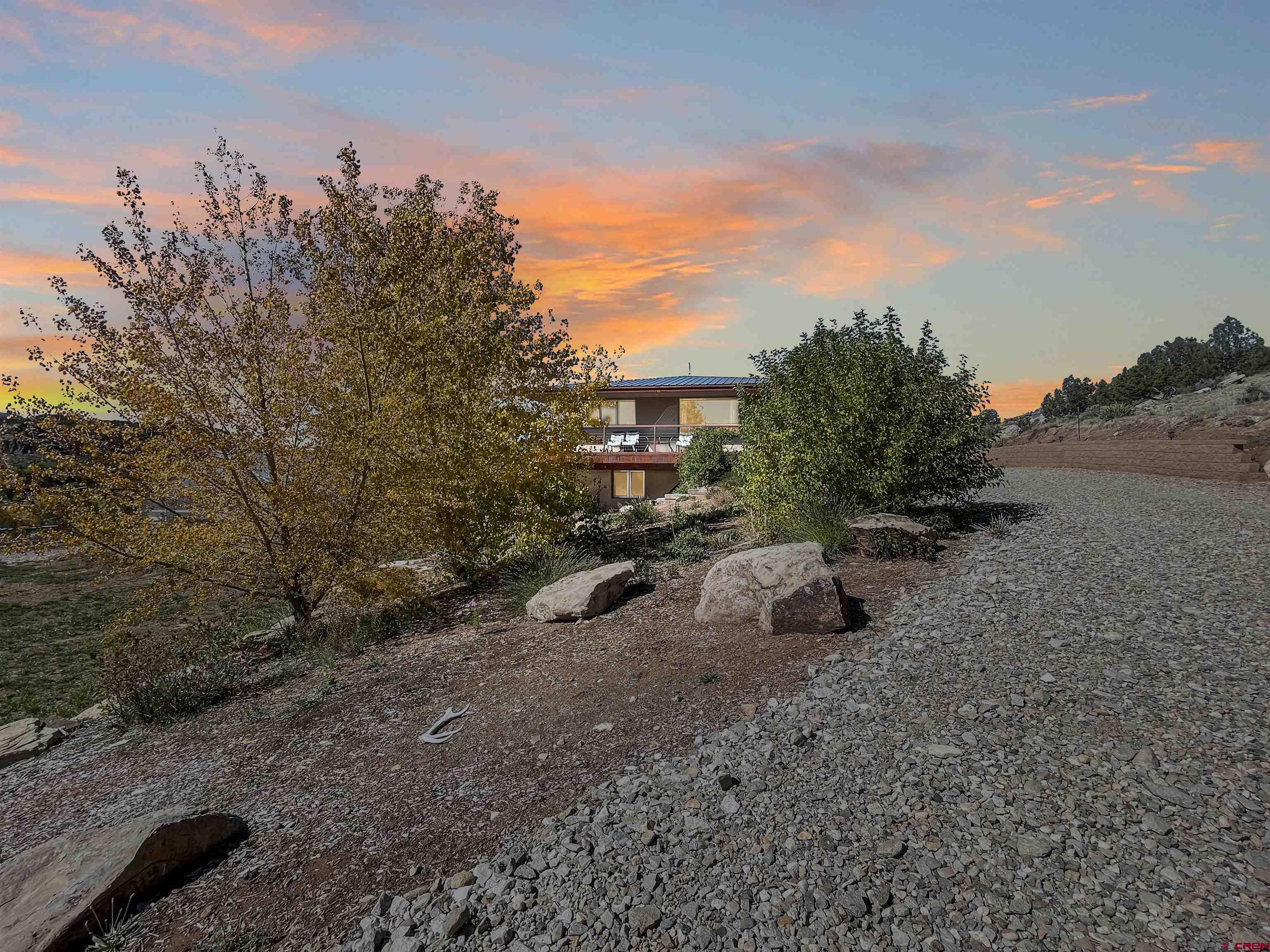 20615 Rd G Cortez, CO 81321 - Photo 13 of 43 a backyard of a house with lots of green space