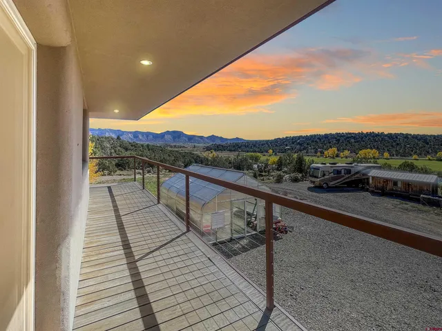 a view of balcony with furniture