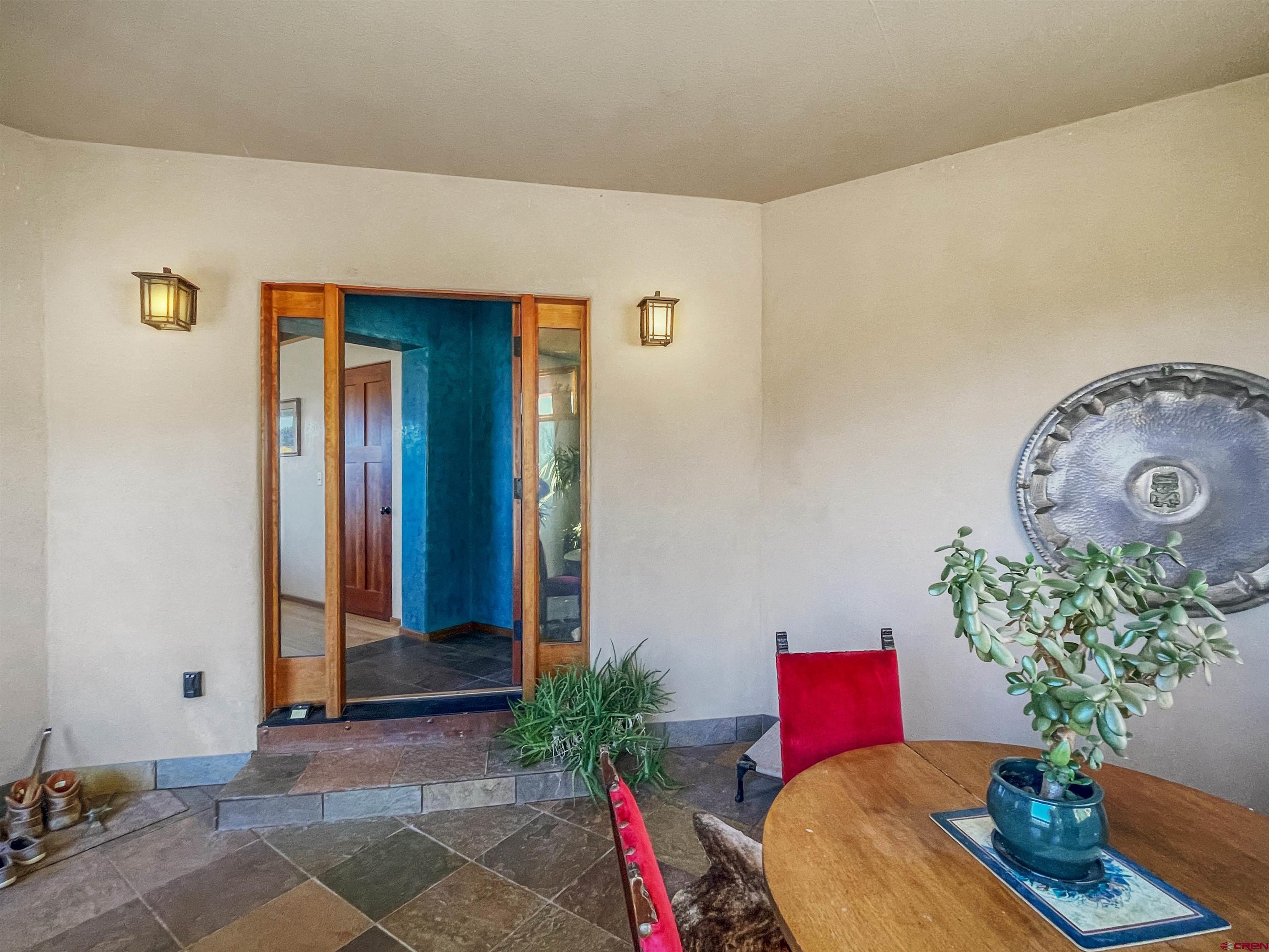 20615 Rd G Cortez, CO 81321 - Photo 21 of 43 a living room with furniture and flowers