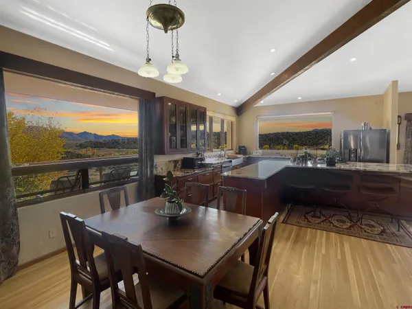 a view of a dining room with furniture window and outside view