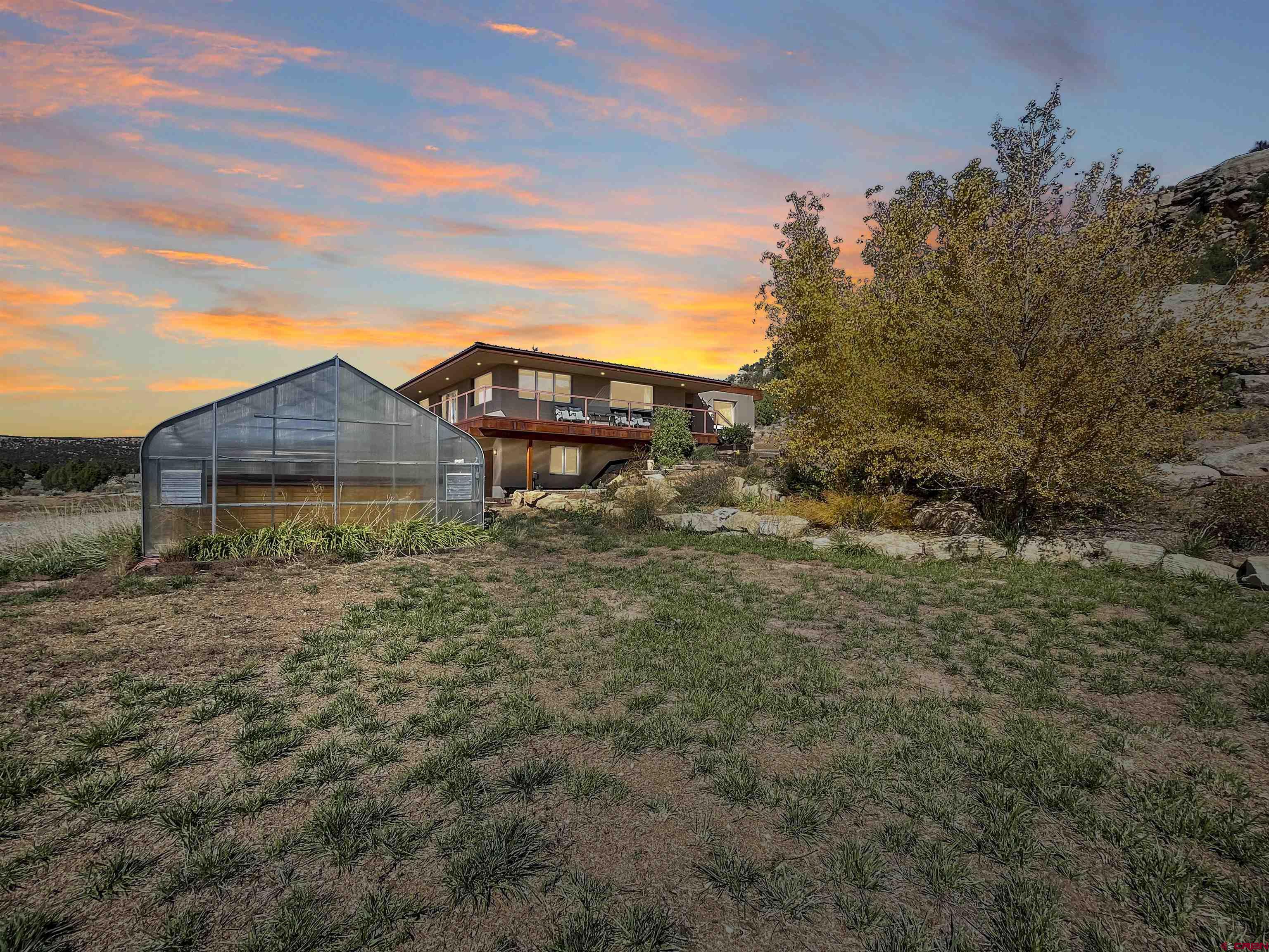 20615 Rd G Cortez, CO 81321 - Photo 3 of 43 a view of a house with a yard and plants