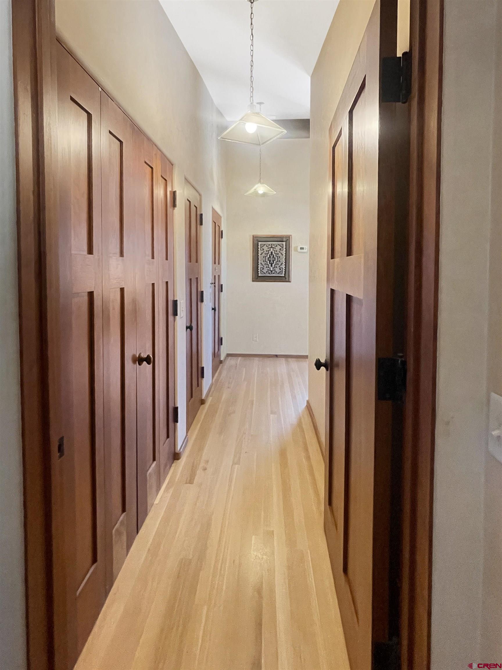 20615 Rd G Cortez, CO 81321 - Photo 37 of 43 a view of a hallway with wooden floor